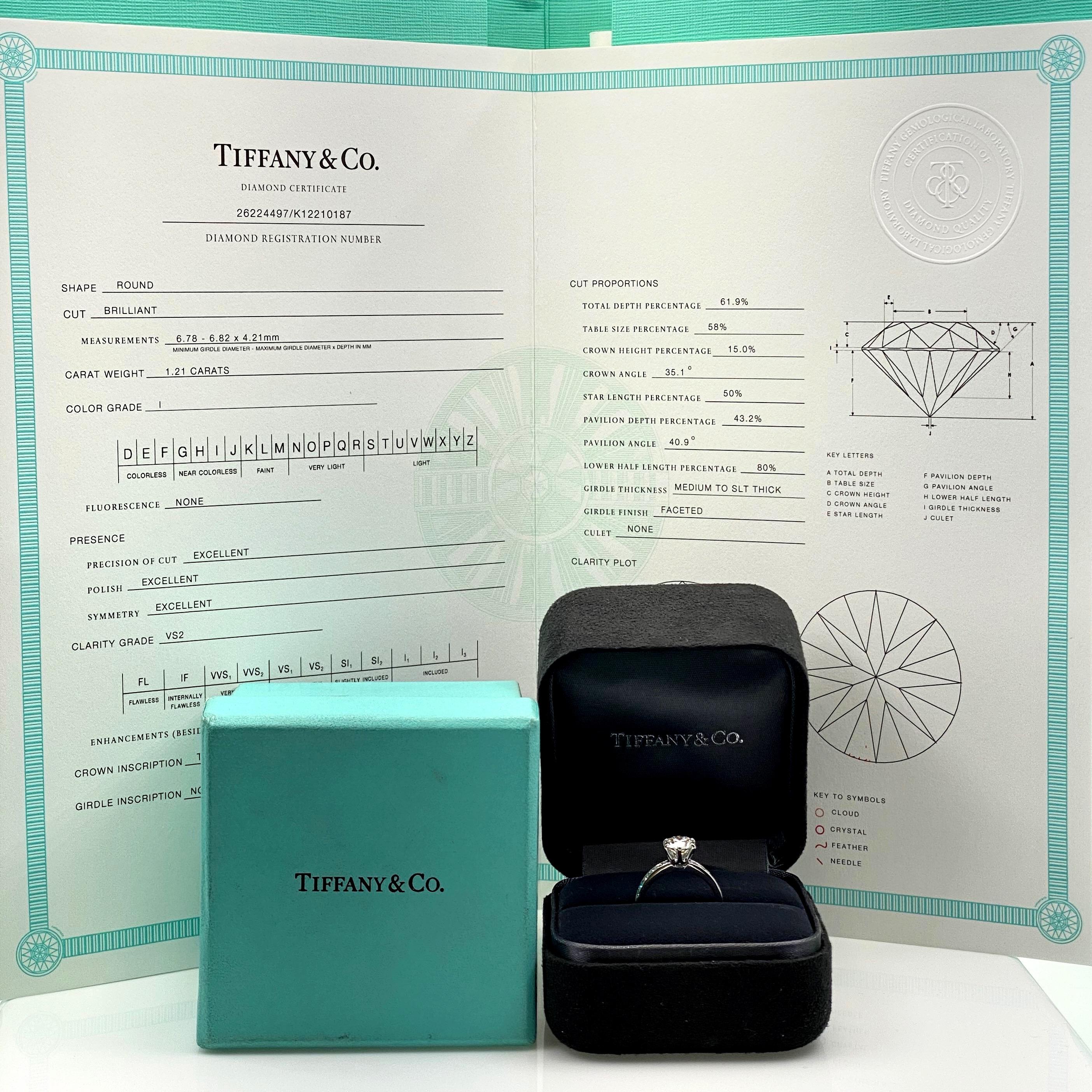 Tiffany & Co Engagement Ring
Style:  Tiffany Setting Engagement Ring with Channel-Set Diamond Band
Ref. number:  26224497 / K12210187
Metal:  Platinum PT950
Size / Measurements:  4.5
TCW:  1.41 tcw
Main Diamond:  Round Brilliant Diamonds 1.21