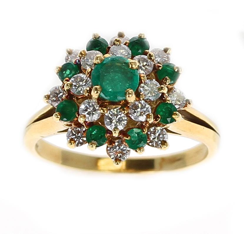 A Tiffany & Co. Round Emerald and Diamond Cluster Ring made in 18K Yellow Gold. Gross Weight: 5.02 grams. Ring Size US 6.50. 
 