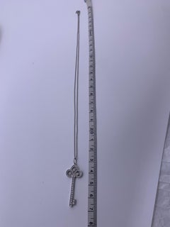 Tiffany & Co Round Nrilliant Diamonds Platinum Fleur de Lis Key Pendant Medium