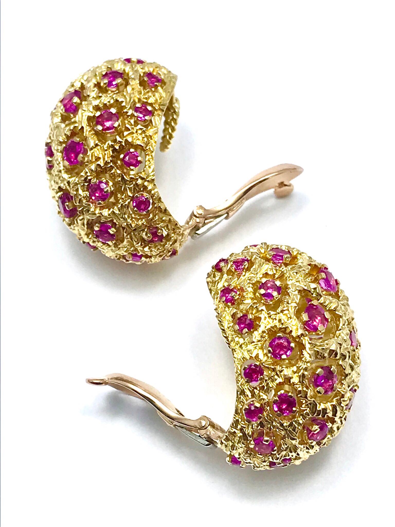 This is a great pair of Tiffany & Co. round cut Ruby and 18 karat yellow gold domed clip earrings.  The earrings contain 44 round Rubies combining for a total weight of 3.00 carats, they are all prong set throughout, with the gold mimicking a coral