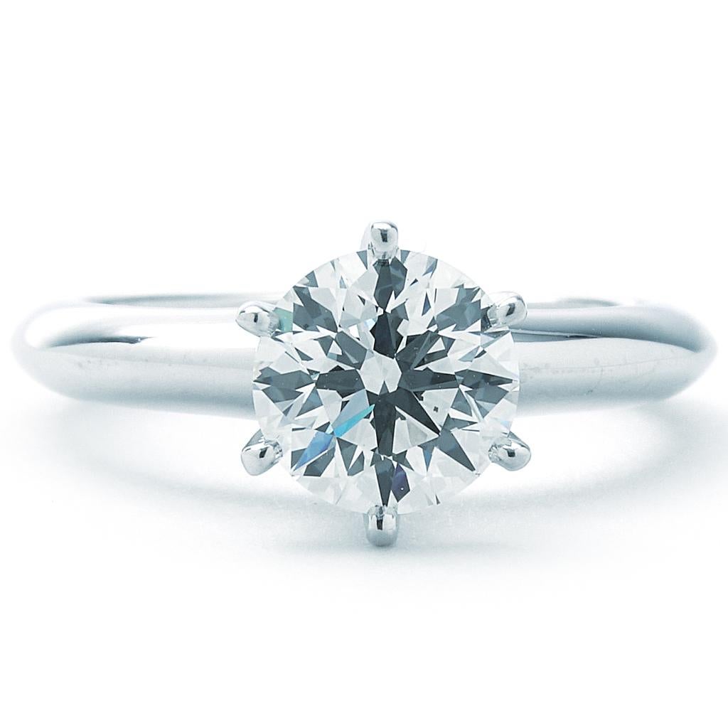 This Tiffany & Co. ring is made of platinum and weighs 3.9 DWT (approx. 6.07 grams). It contains one round H and VS1 clarity diamond weighing 1.33 CT. Size 4.5