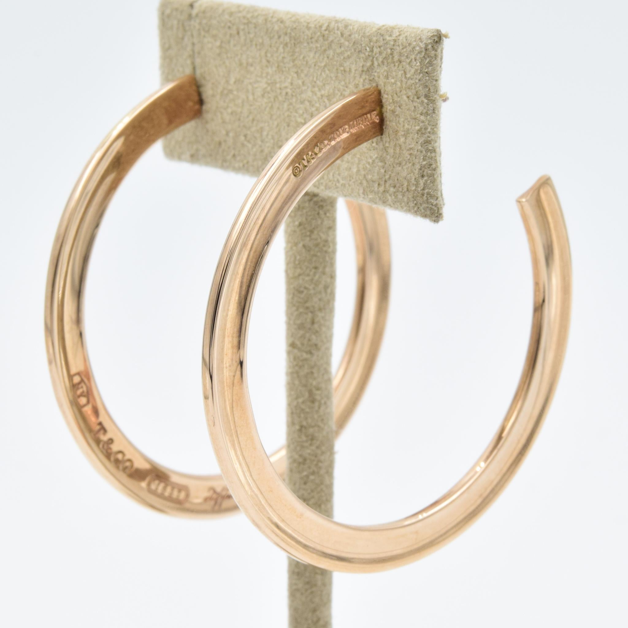 These Tiffany and Co. Rubedo hoop earrings were recently traded in to our store and are in very good condition. Rubedo is a special blend of copper, gold, and a few other metals. These earrings are roughly 5cm in diameter.