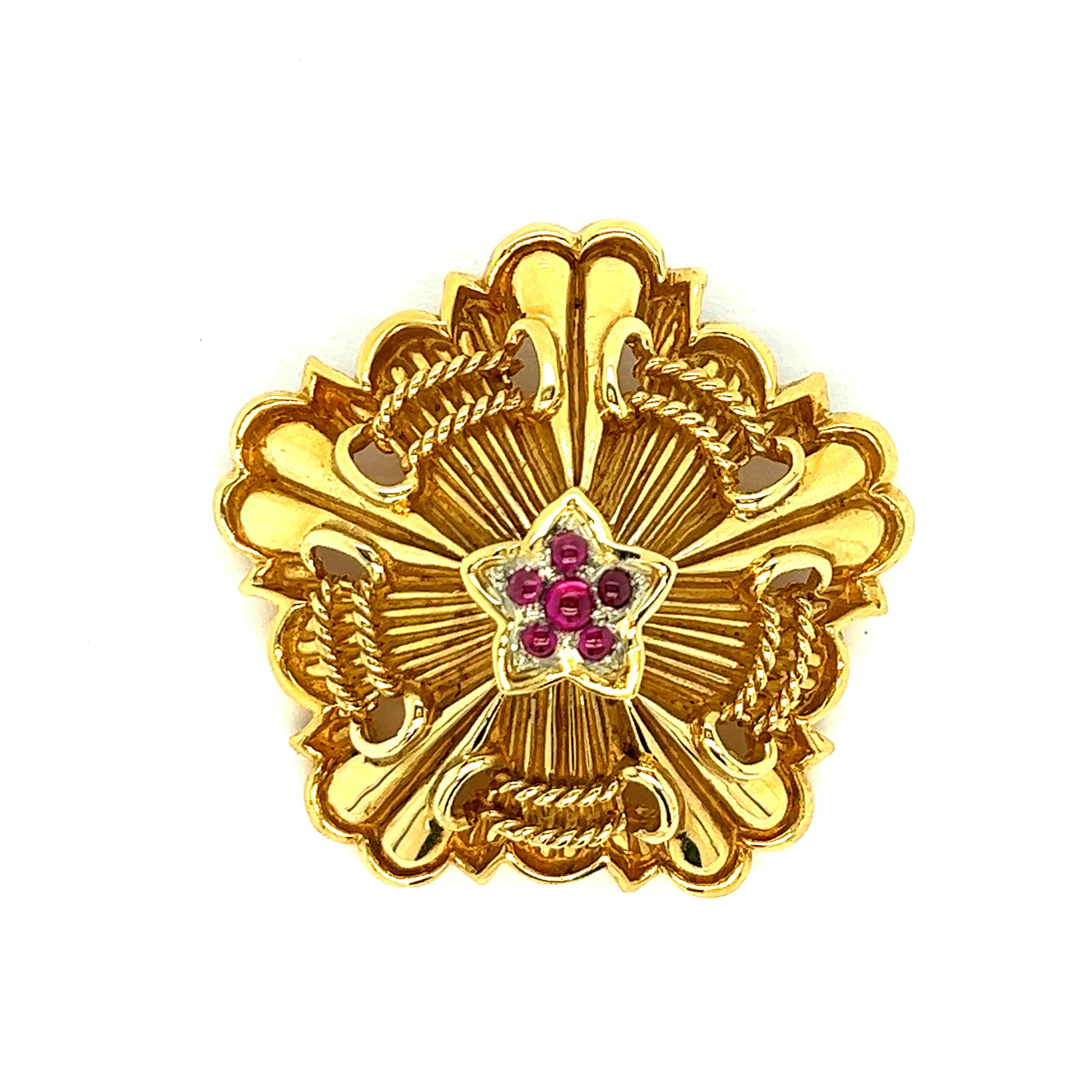 Tiffany & Co. ruby gold brooch

Cabochon rubies, 18 karat yellow gold, very well-made with beautiful details; marked Tiffany, 18k

Size: width 1.88 inches, length 1.75 inches, depth 0.63 inch
Total weight: 34.2 grams