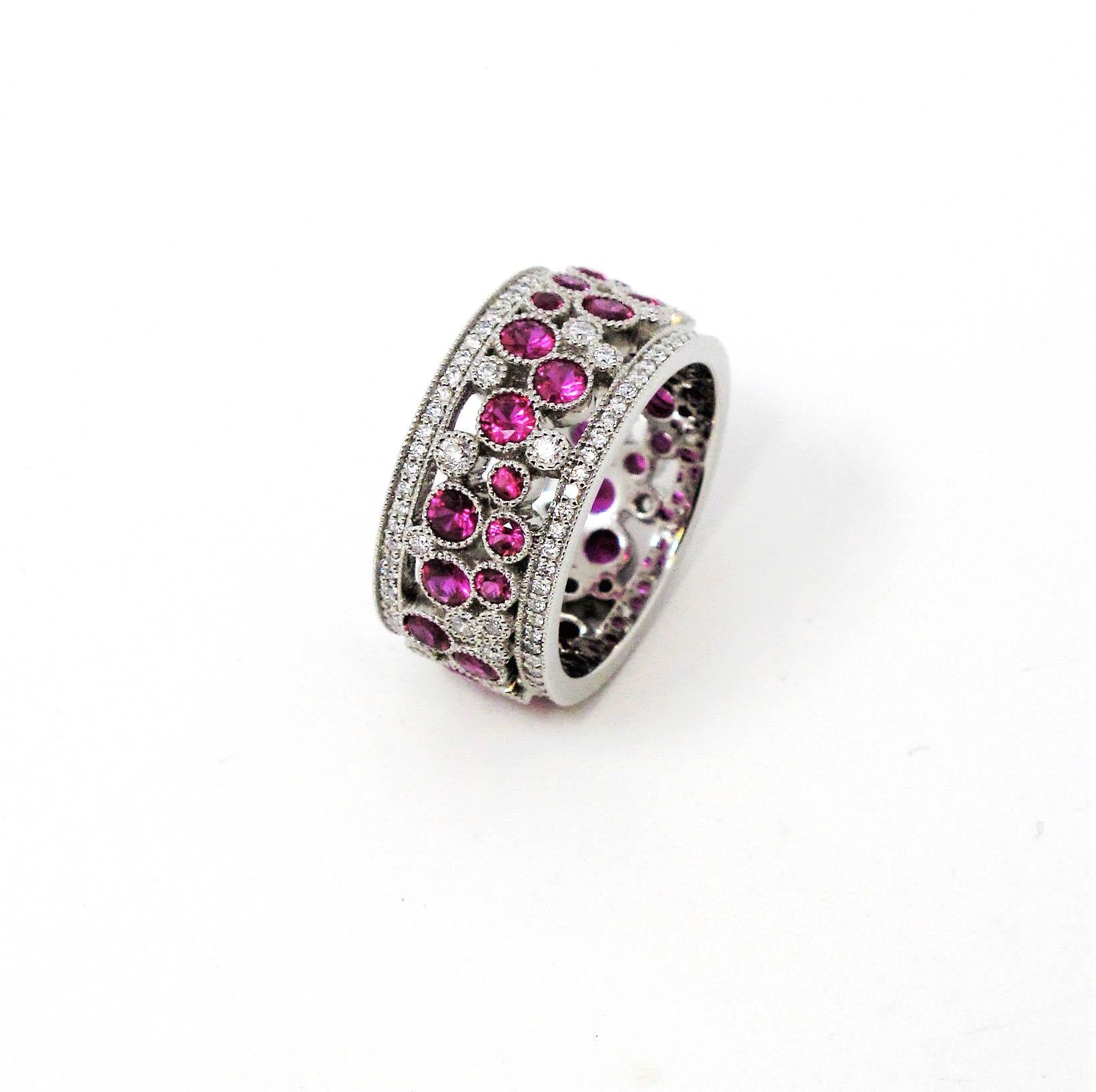 Size 6.5

Stunningly sparkly Cobblestone band ring from Tiffany & Co. This amazing piece is filled with  dazzling white diamonds and sparkling red rubies set in a playful path of cobblestones throughout the ring. You'll simply adore how these