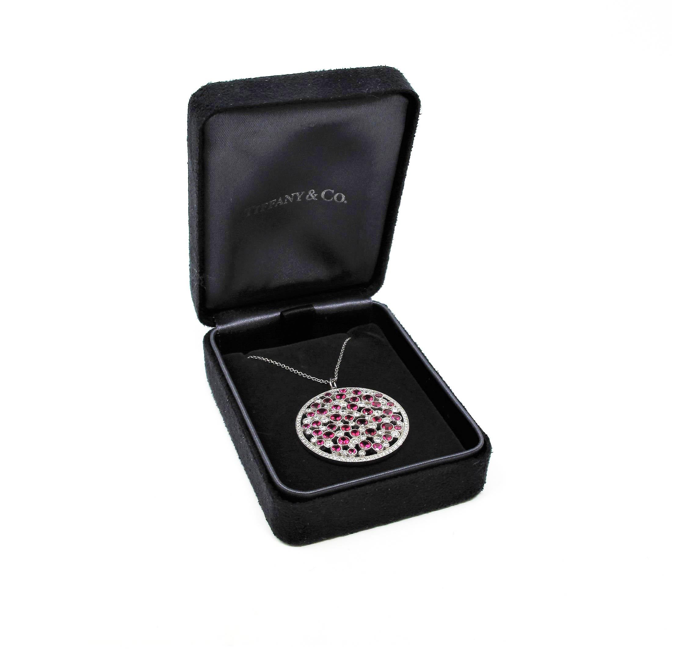 Looking to add a fun, yet sophisticated pop of color to your look? Then look no further than this absolutely stunning, brightly colored Cobblestone medallion necklace by renowned jewelry retailer, Tiffany & Co. Featuring luxurious, rich ruby