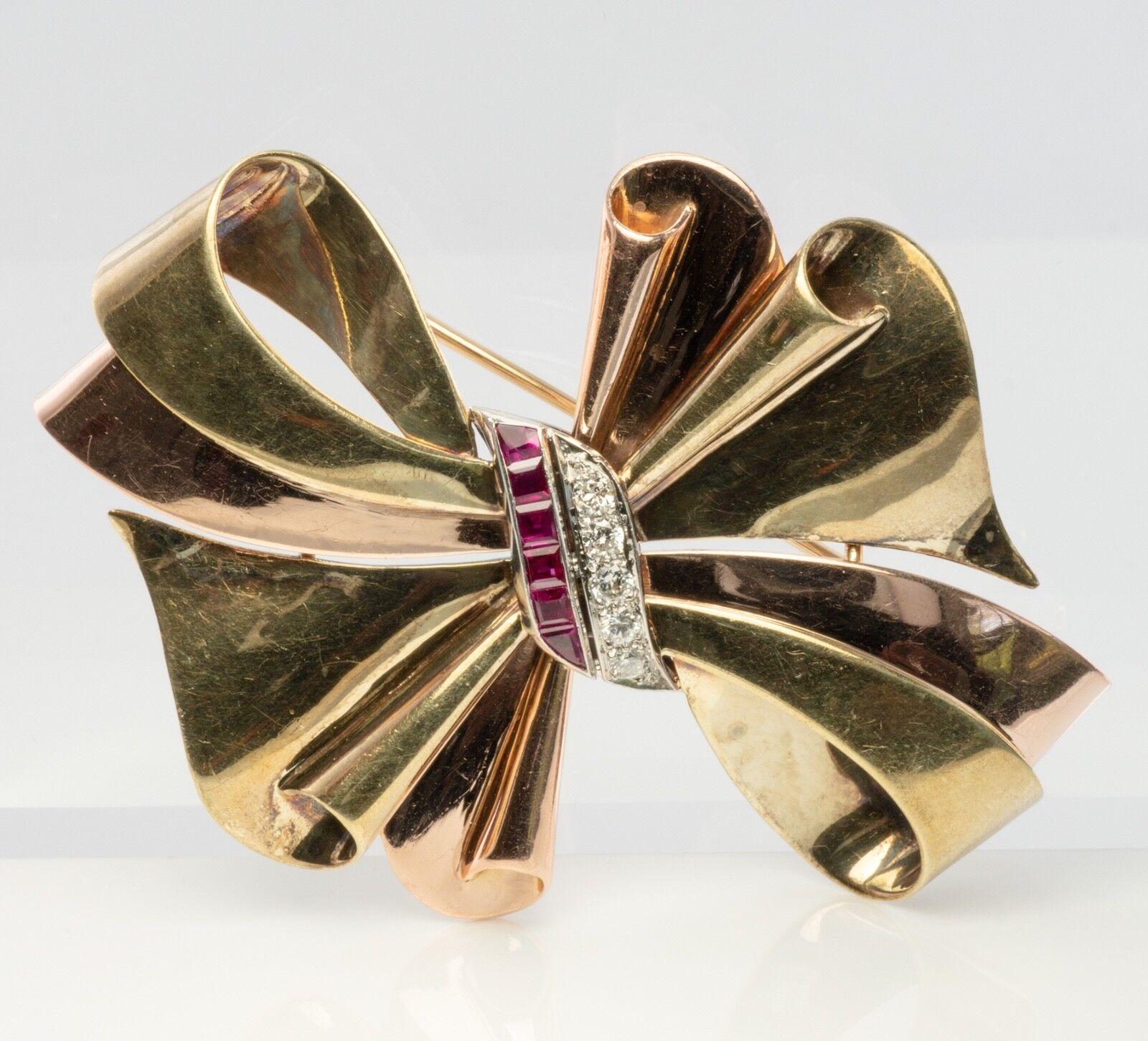 Vintage authentic Tiffany & Co diamond brooch, bow brooch, ruby brooch, ribbon brooch. This gold brooch is finely crafted in combination on of 14K Yellow and Green Gold. Six natural Earth mined Rubies measure about 2mm. They are very clean and