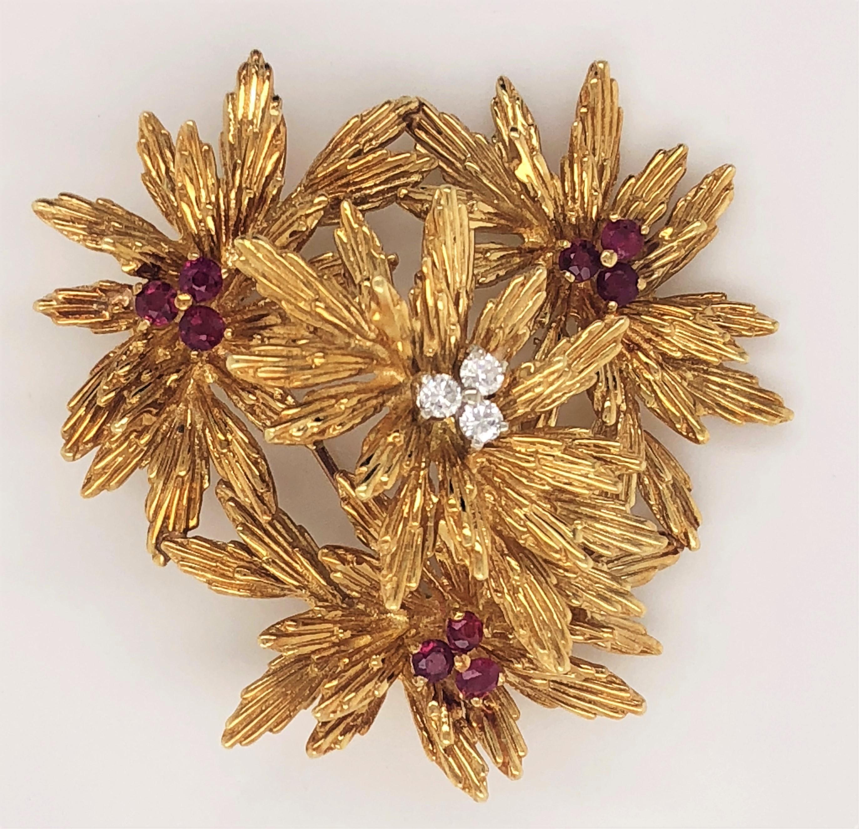 A chrysanthemum inspired floral bouquet in bright eighteen karat 18k yellow gold create this cheerful brooch from the 1960's Collection by Tiffany & Co. Each burst is carefully hand-tooled chased with texture details on the petals to create this
