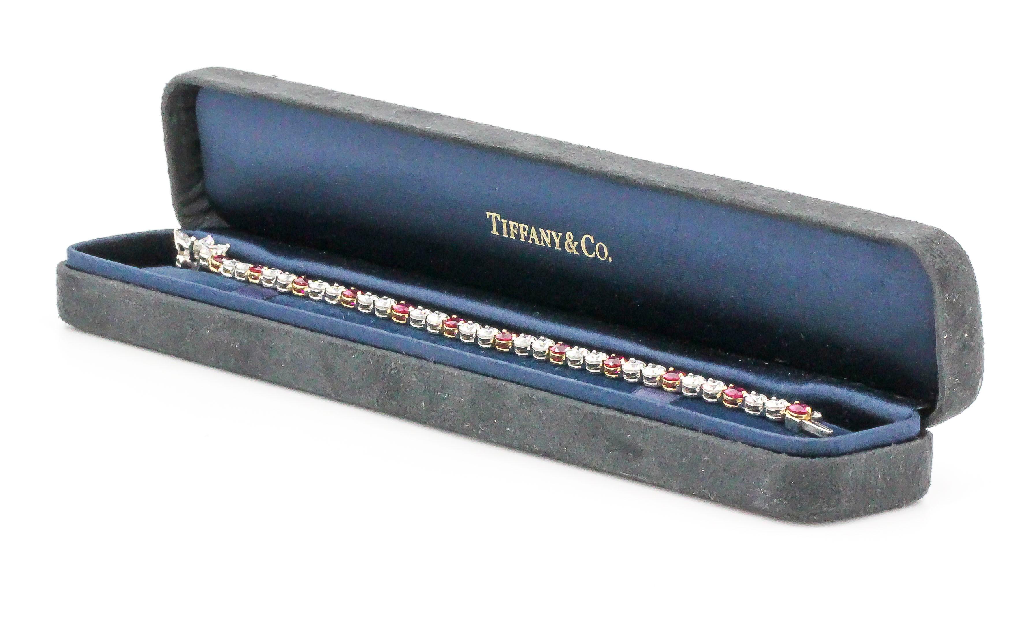 Classic and elegant ruby, diamond, platinum and 18K gold, diamond tennis/line bracelet by Tiffany & Co. It features approx. 5.75 cts of high quality round brilliant cut diamonds, 0.60 cts of marquise cut diamonds, and approx. 2.50 cts of rubies.