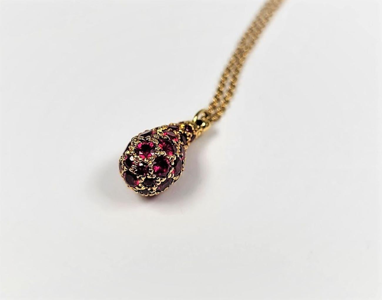 This beautiful pave set ruby pendant necklace is in 18 karat gold and is from the Concepts Collection by Elsa Peretti for Tiffany & Co.