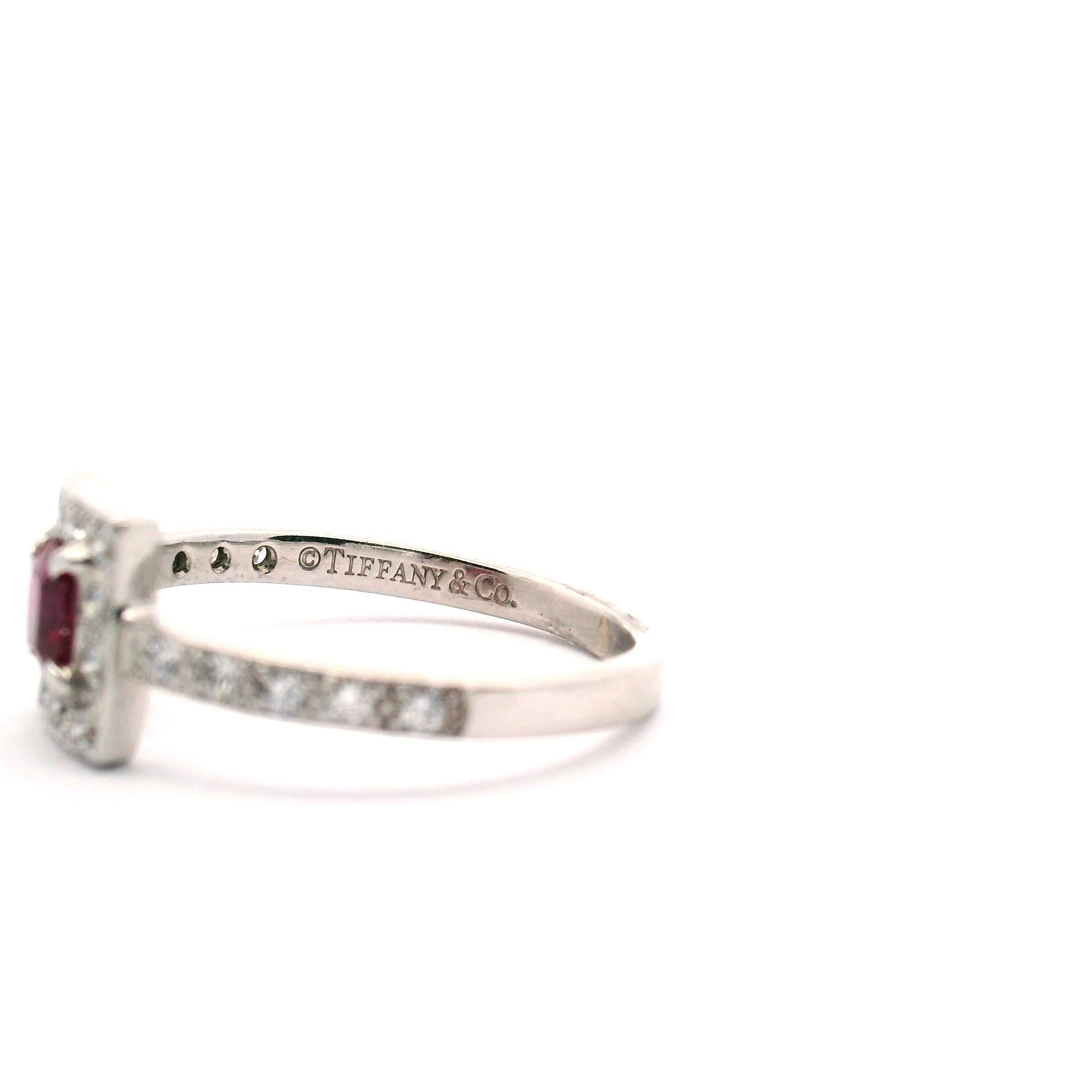 Tiffany & Co. Lady's platinum ring with 1 square modified brilliant cut ruby &  22 round brilliant cut diamonds 

Ruby .40ct.

Diamonds .25cttw.
Clarity grade VVS1
color grade is F-G 