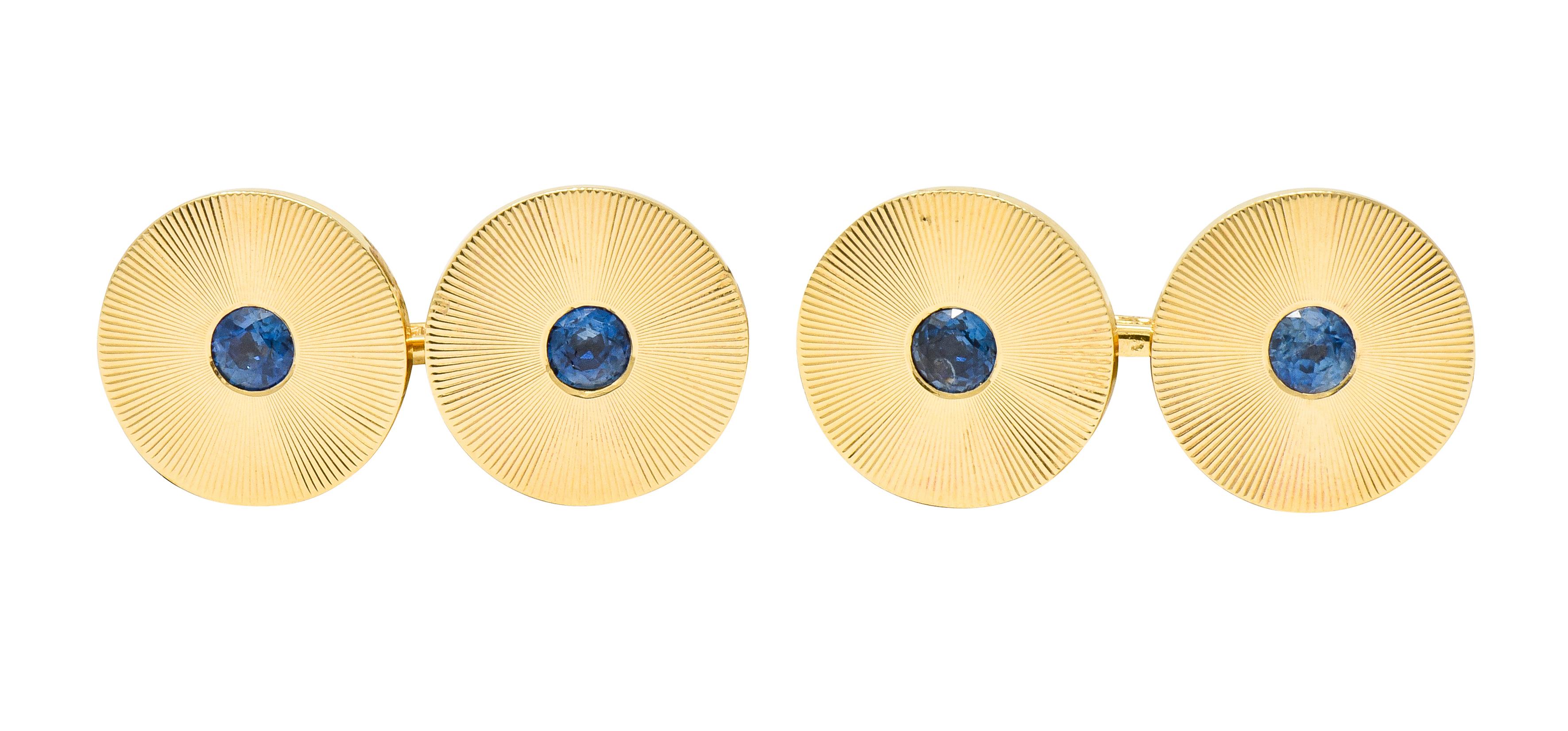 Link style cufflinks terminating as 13.9 mm round disk featuring a deeply engraved radiating motif

With four large matching spring loaded shirt studs featuring the same radiating disk motif, also measures 13.9 mm

And three small spring loaded