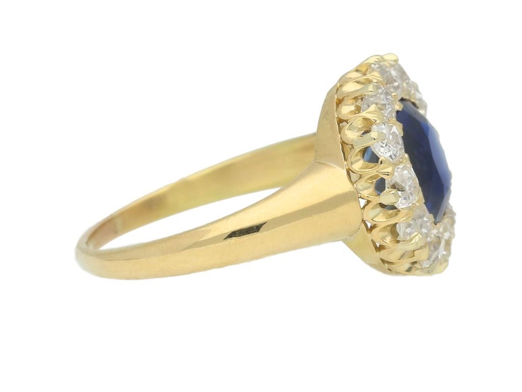 Tiffany & Co. sapphire and diamond cluster ring. Centrally set with a cushion shape old cut natural unenhanced sapphire in an open back grain setting with an approximate weight of 2.30 carats, encircled by a single row of cushion shape old cut