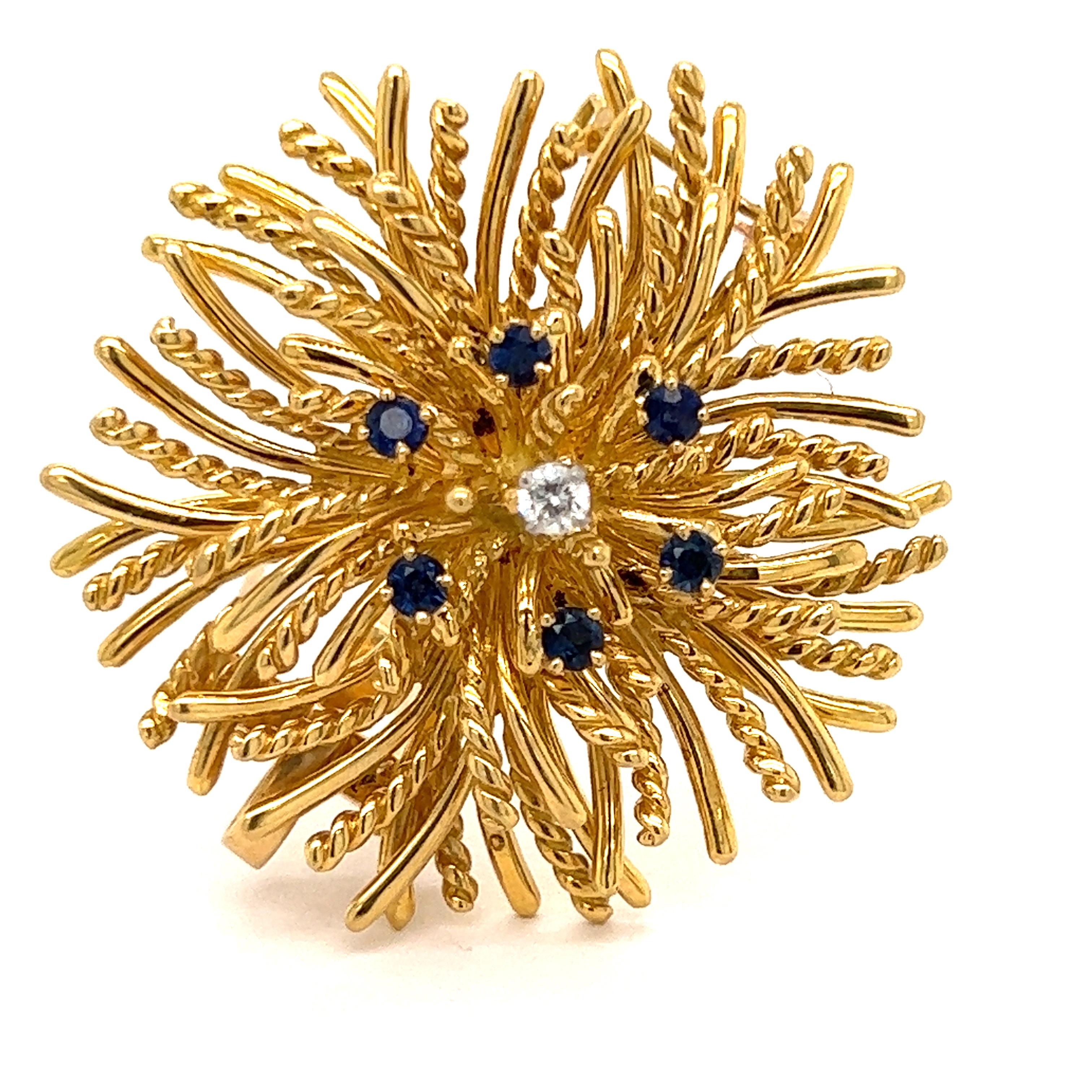 This magnificent and versatile Tiffany and Co. sea urchin pin features six round sapphires, .50 cttw. There is one round diamond, .08 cttw with G color, VS Clarity. Set in 23 grams of 18 Kt yellow gold. This is signed 