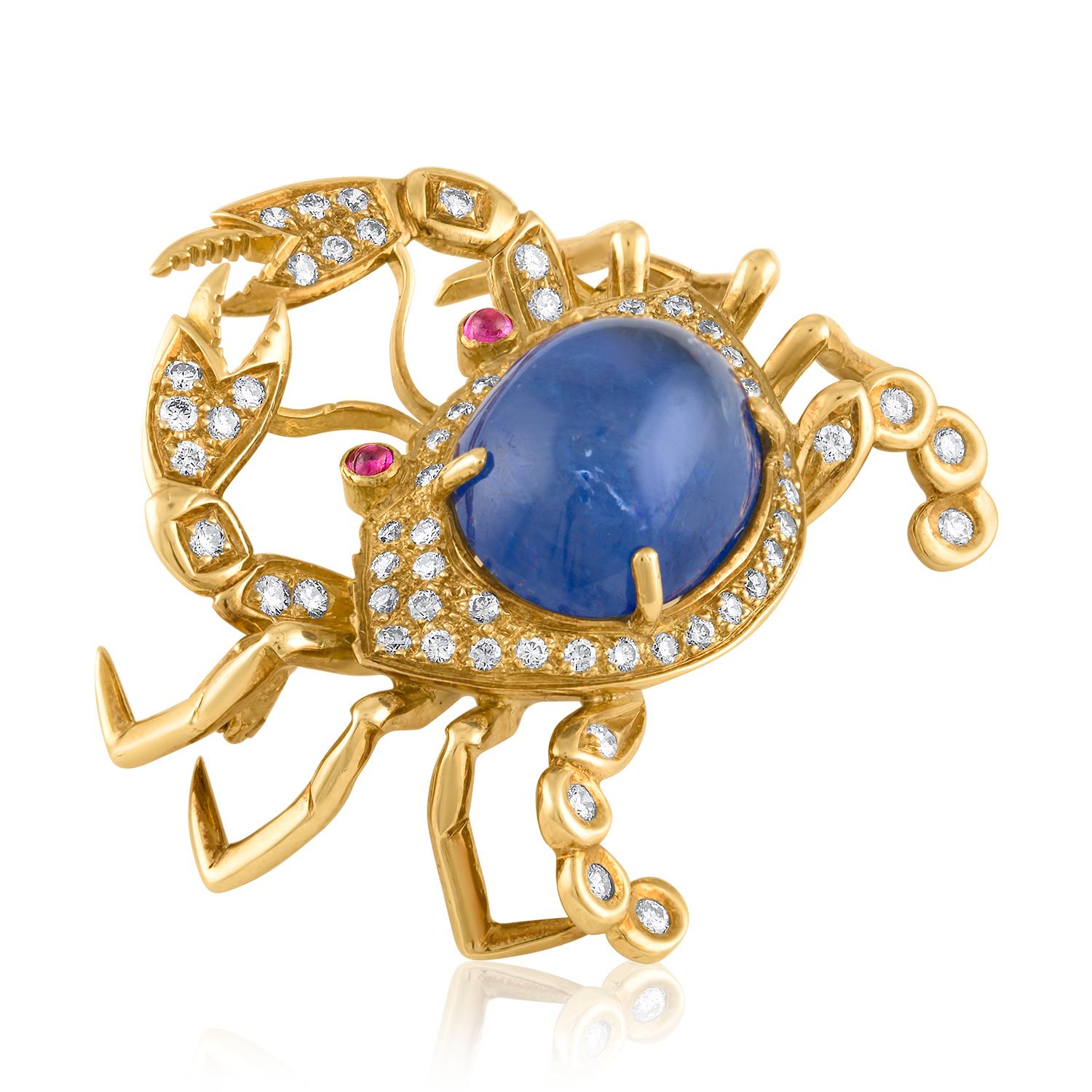18K yellow gold, diamond, sapphire and ruby crab pin by Tiffany & Co is pave-set with diamonds with two ruby cabochon eyes, and an oval blue sapphire cabochon body, approx. 7 carats. 