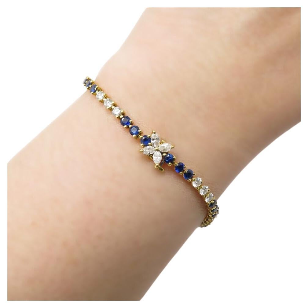  Introducing a magnificent Tiffany bracelet, featuring approximately 1.7 carats total weight of diamonds, primarily in the G-H color range and VS clarity. Complemented by natural sapphires totaling around 1.8 carats, this exquisite piece measures