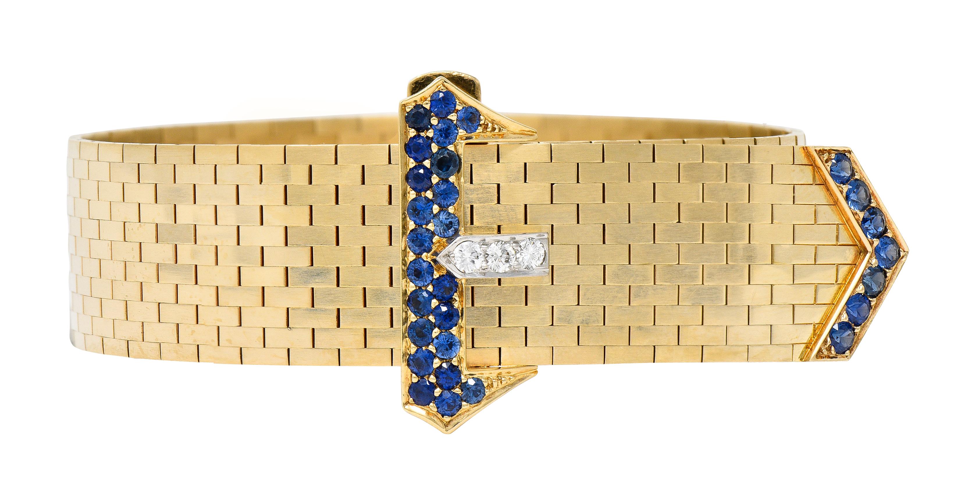 Designed as a flexible meshed gold chain terminating with a belt buckle and tongue motif
Buckle terminals feature round-cut sapphires weighing approximately 1.45 carats total
Transparent medium blue in color - bead set
With round brilliant cut