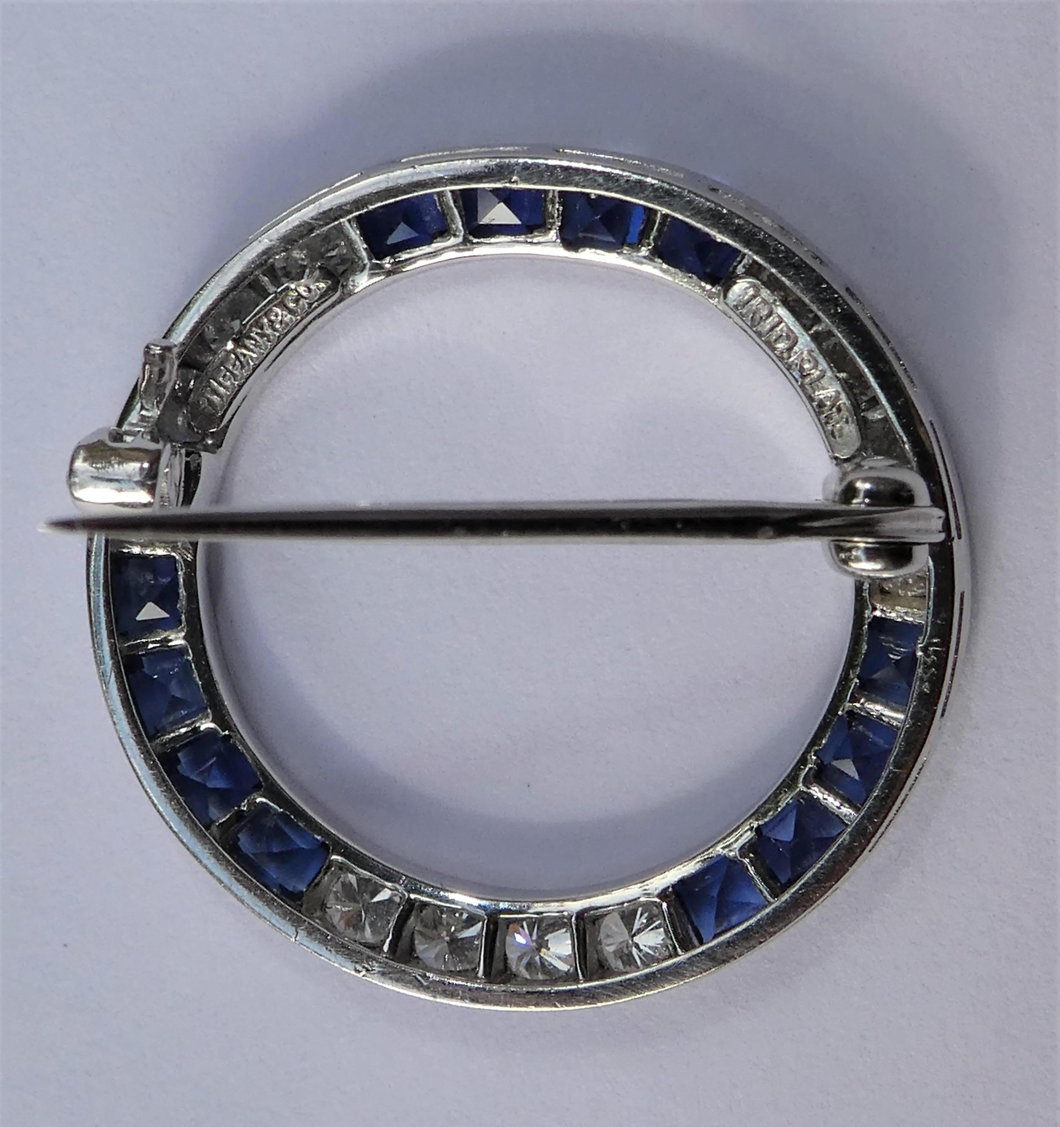 This circle brooch was crafted in the 1950s by Tiffany & Co. in N.Y. in platinum. One of the reasons that it looks fabulous on any spot is its classic geometic design, it looks e.g. lovely on a sweater or a dress. it comes in its original case and