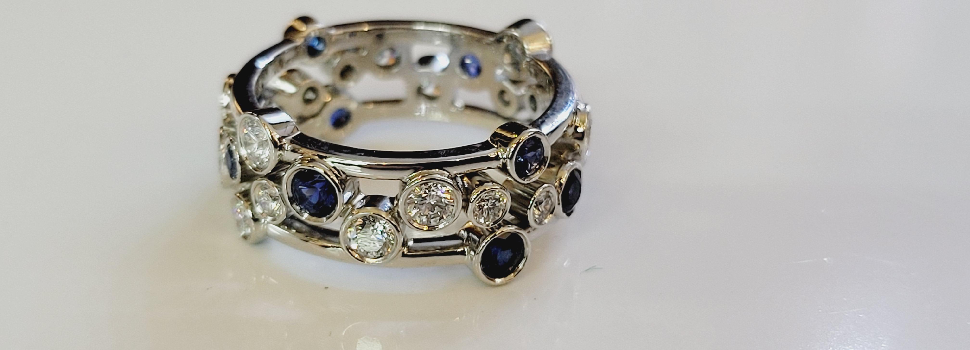  Tiffany & Co Platinum Bubble Diamond Sapphire Ring.
 Made from Solid Platinum 950 and weighs 10.6 grams.
 It holds total of 1.51ct of Natural Round Brilliant Diamonds F Color VS Clarity & Natural Blue Sapphire. 
Ring is a size 6 3/4, and is 8.6mm