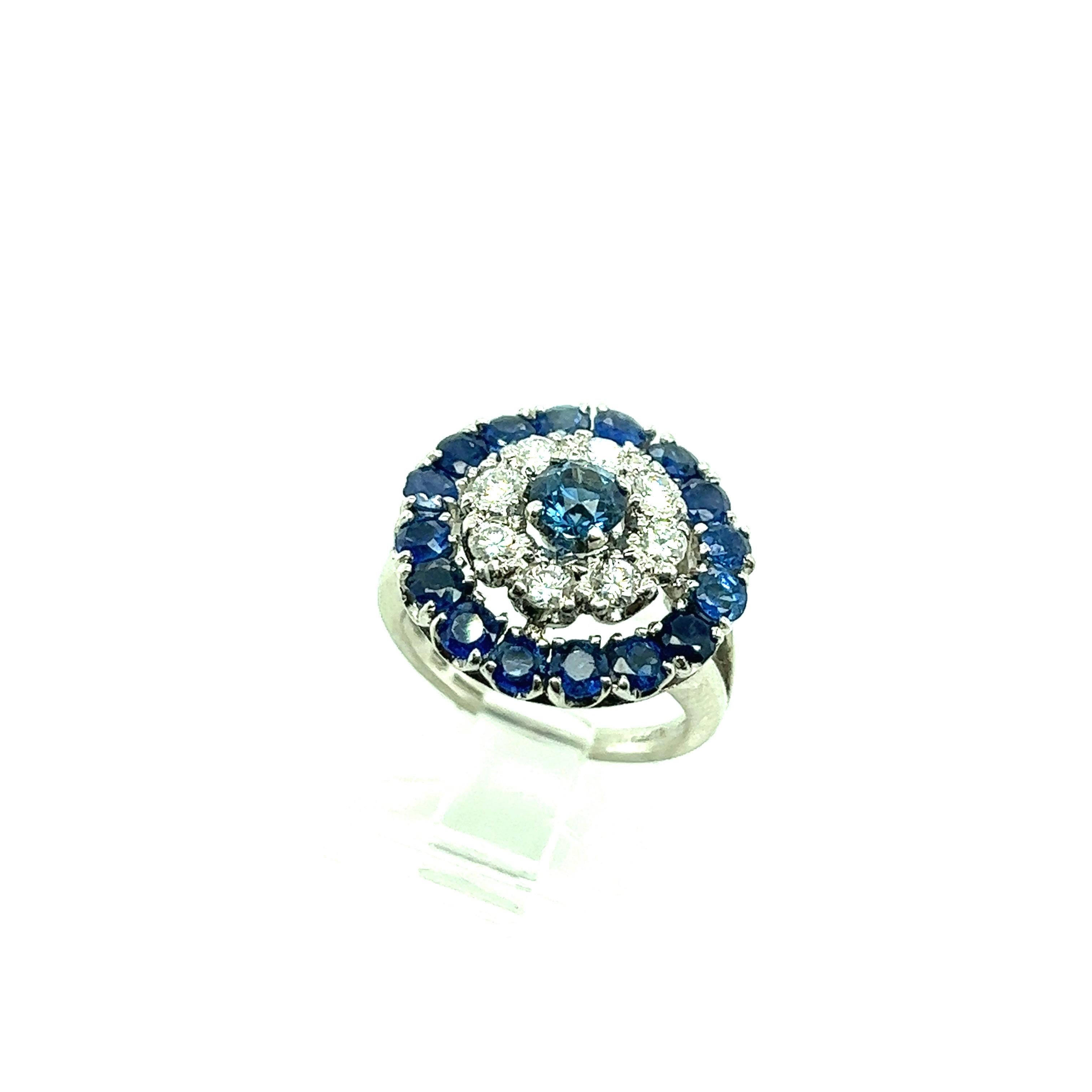 Tiffany & Co. ring with approximately 2.42 carats of sapphires and 0.64 carat of diamonds set on platinum. Marked: Tiffany / Plat. Total weight: 9.8 grams. Size 2.75. 