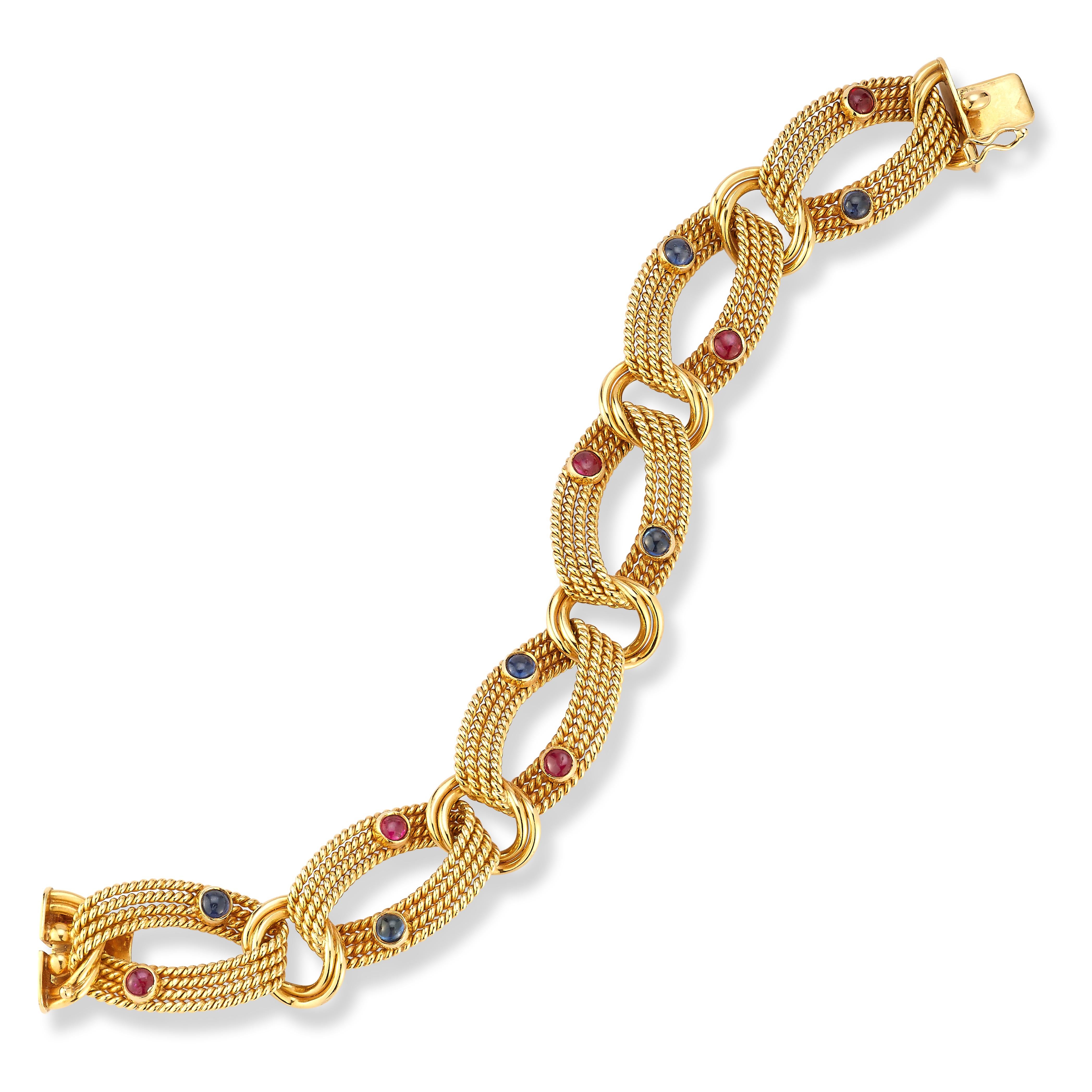 Tiffany & Co. Sapphire & Ruby Gold Bracelet

An 18 karat textured yellow gold link bracelet consisting of 6 rope motif links each set with a cabochon sapphire and a cabochon ruby

Measurements: 7.5