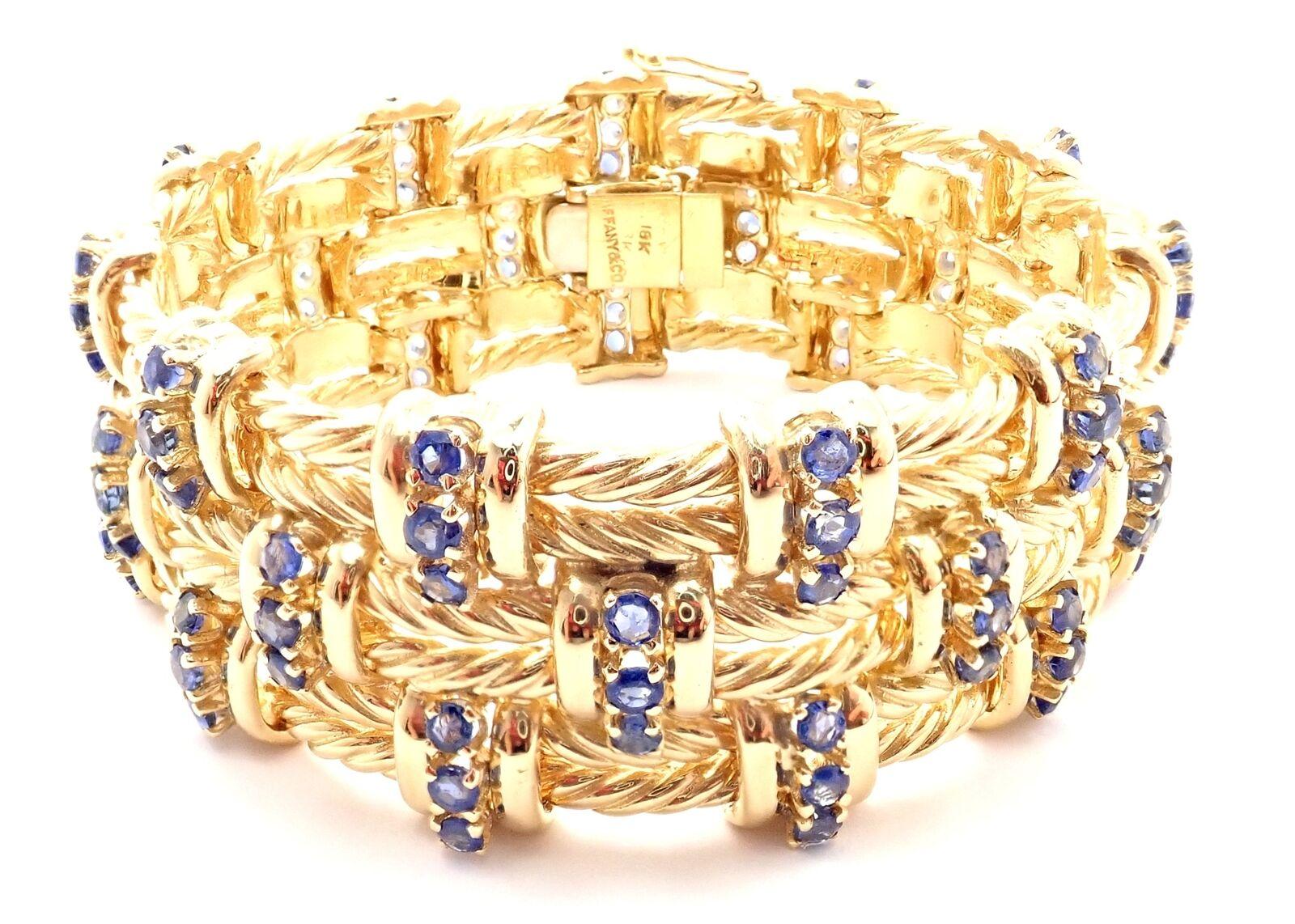 18k Yellow Gold Sapphire Twisted Rope Link Bracelet by Tiffany & Co.
With 99 round sapphires weight approximately 9.24ct
This bracelet comes with Retail Replacement Valuation from Tiffany store in NYC.
Details:
Weight: 103.1 grams
Length: 6