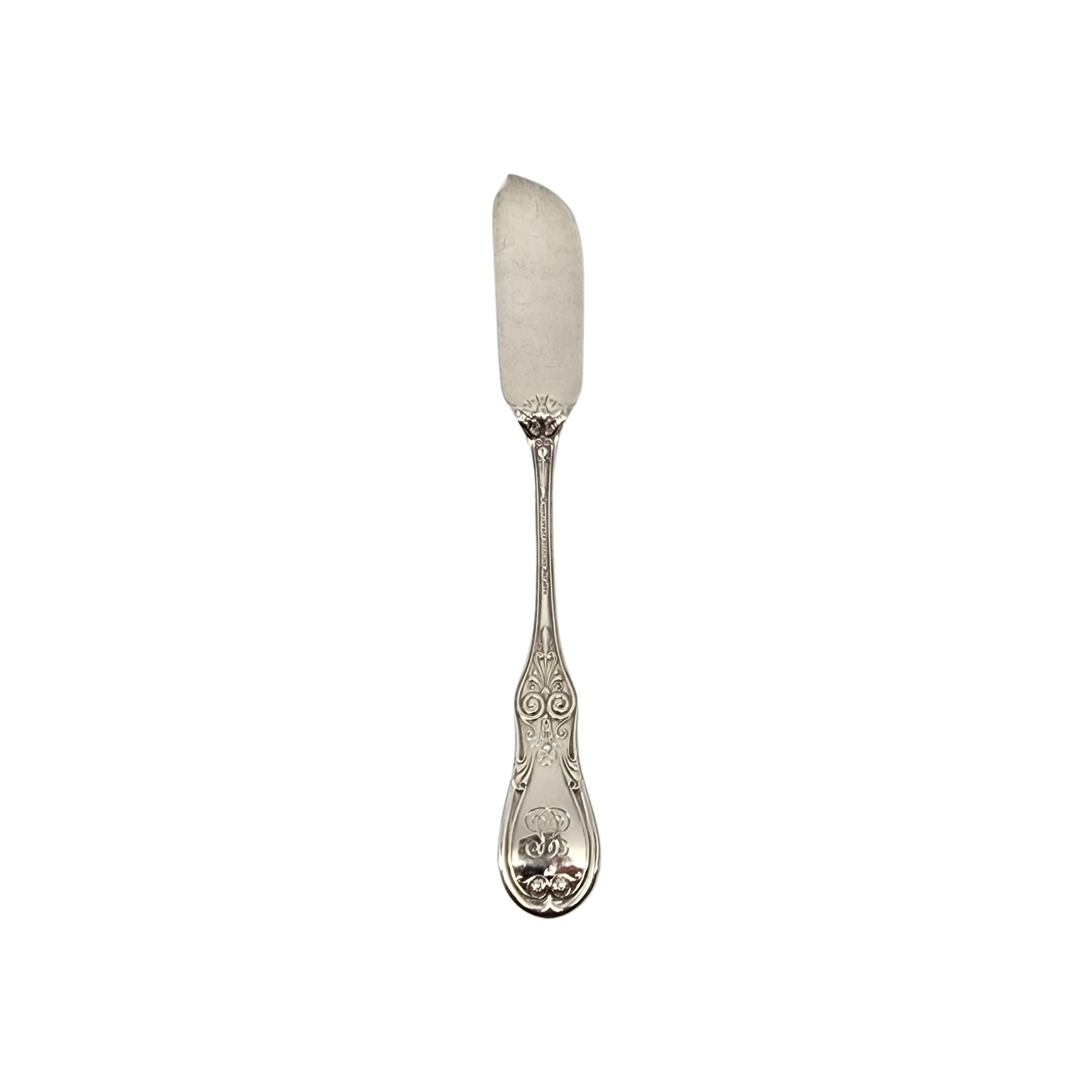 Sterling silver brite cut master butter knife by Tiffany & Co in the Saratoga/Cook/Kings pattern with monogram.

Monogram appears to be ES (on the  back of the handle).

This pattern was designed by Edward C Moore and was first introduced as Kings