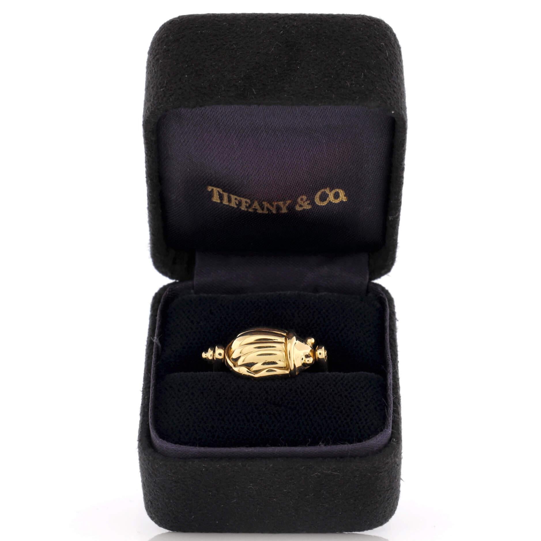 Condition: Good. Moderately heavy wear throughout commensurate with age.
Accessories: No Accessories
Measurements: Size: 7.5, Width: 2.35 mm
Designer: Tiffany & Co.
Model: Scarab Ring 18K Yellow Gold
Exterior Color: Yellow Gold
Item Number: 216744/5
