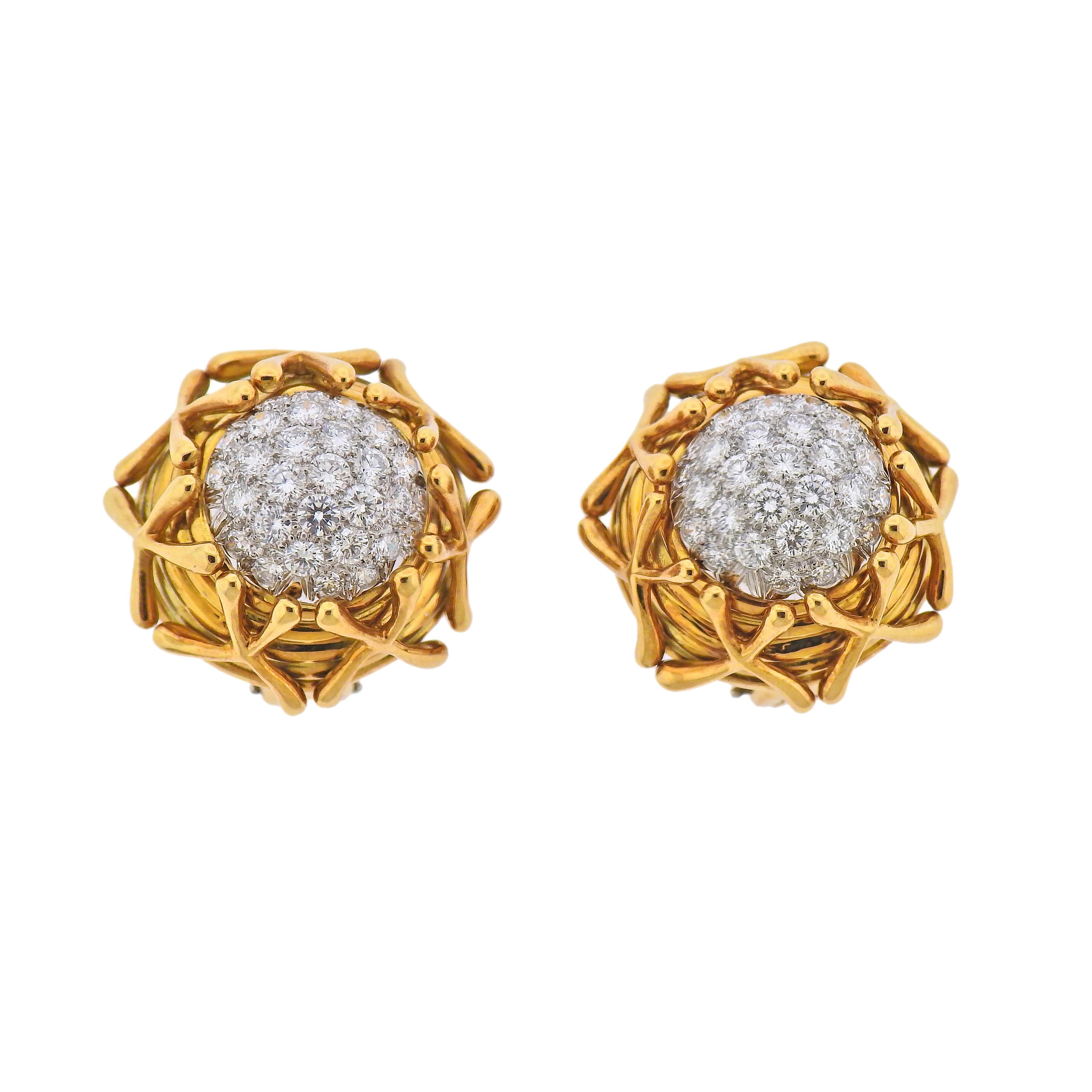 Pair of 18k gold and platinum earrings, designed by Jean Schlumberger for Tiffany & Co, set with approx. 2.00cts in diamonds. Earrings are 23mm in diameter. Marked: Tiffany & Co, Schlumberger, pt950, 750. Weight - 32.4 grams.