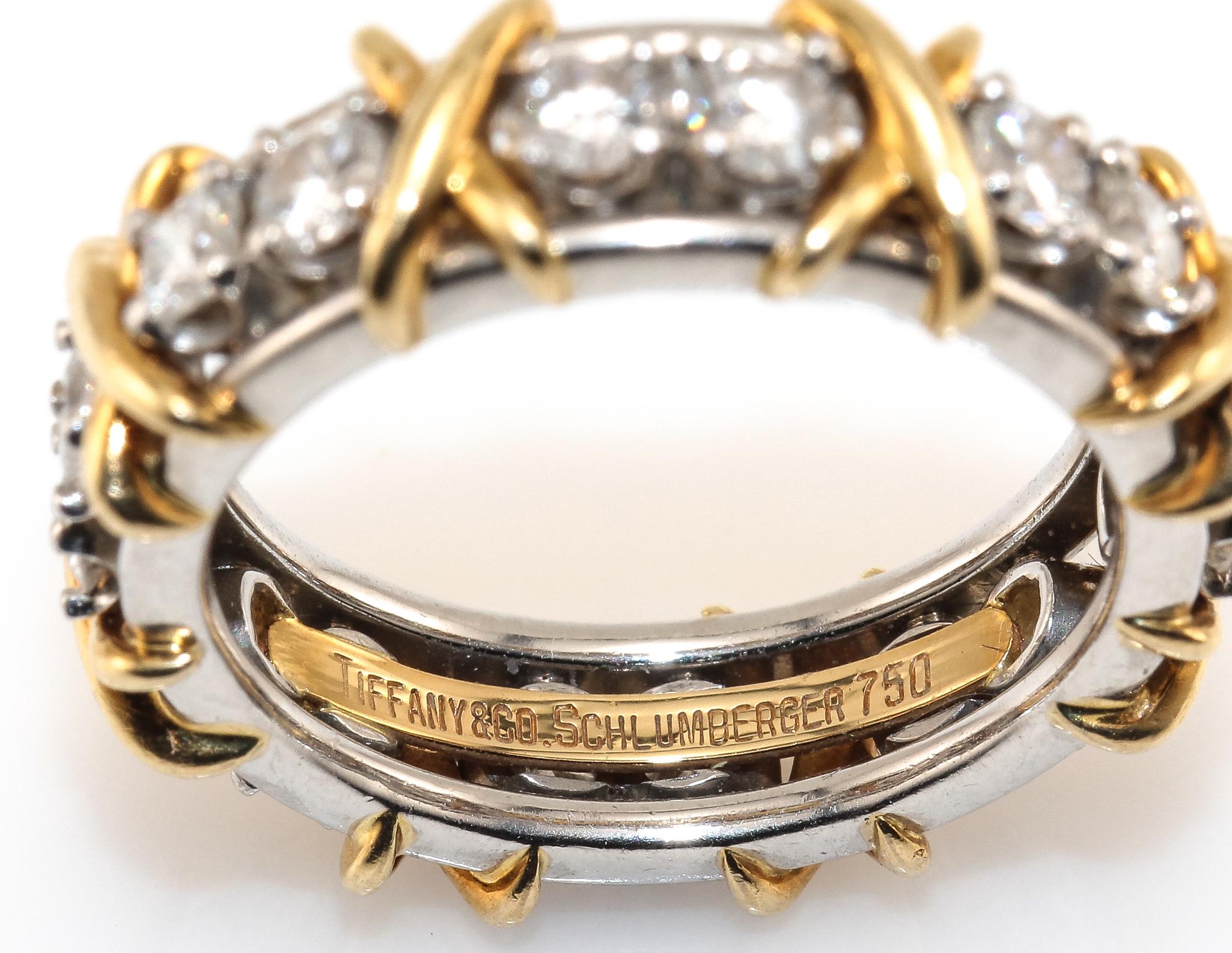 For the Tiffany & Company Schlumberger Collector is this beautifully crafted 18K White and Yellow Gold Diamond Eternity Ring. The band has  (16)  Round Brilliant Cut Diamonds, F in Color, VS in Clarity for approximately 1.20ctw. set in White Gold