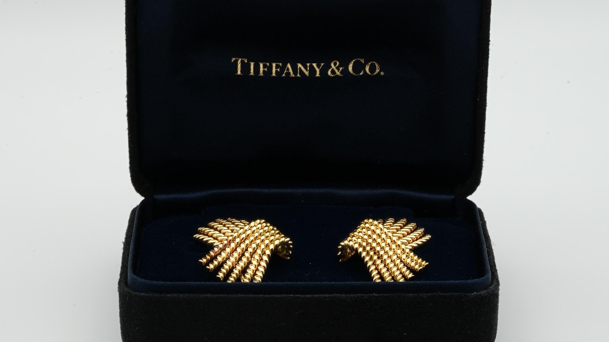 Pair of Schlumberger for Tiffany & Co. 18 Karat Yellow Gold ear clips from the 1970's.

Hallmarks: Tiffany & Co. Schlumberger 750 
Total approx. weight of ear clips is 16.32 grams (gross)
Dimensions: ear clips measure approx. 0.78