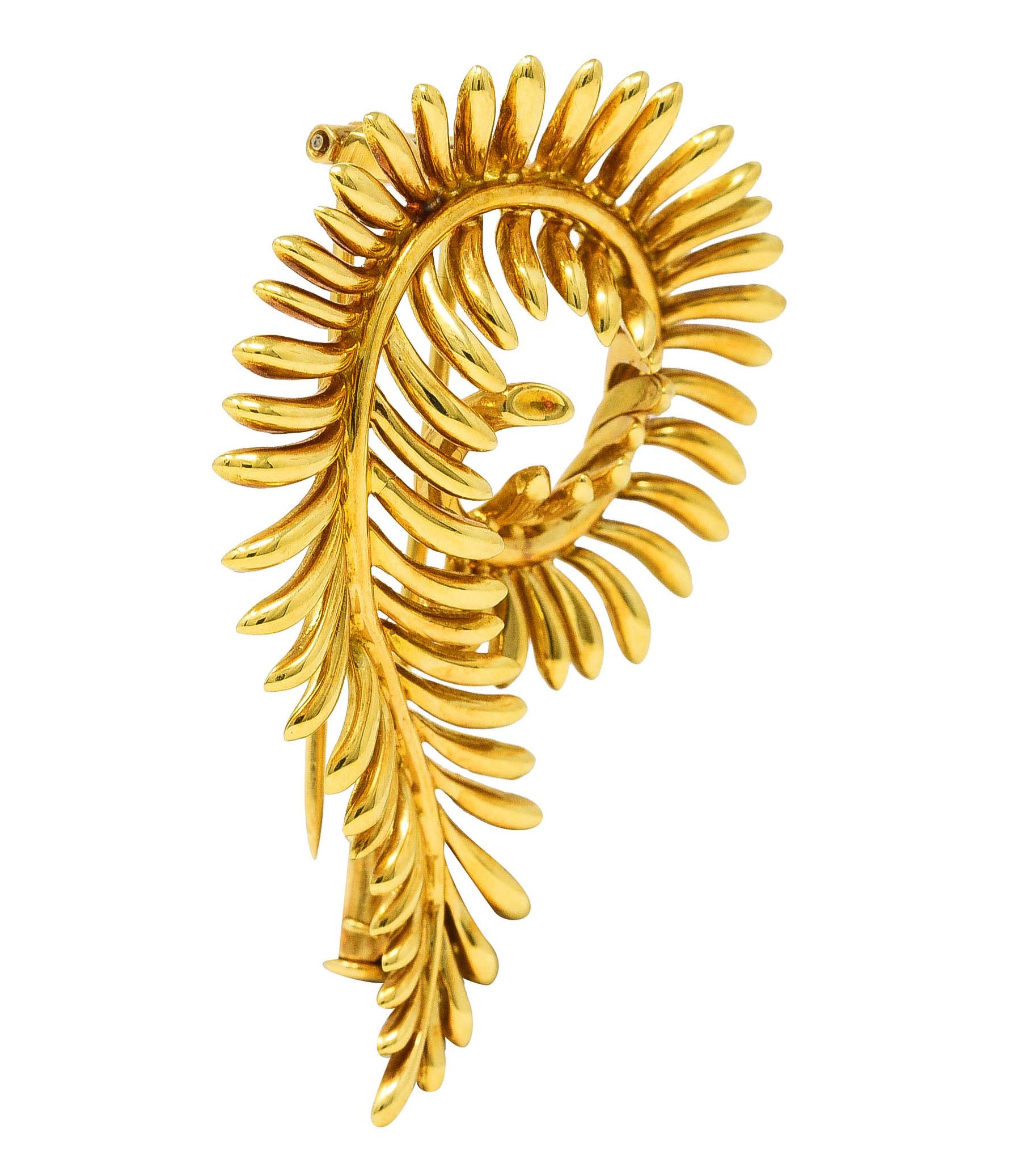 Brooch is designed as a stylized furling feather. With elegant, rounded tendrils and high polished finish. Stamped 750 for 18 karat gold. Fully signed Tiffany & Co. Schlumberger. Circa: 1960's. Measures: 1 1/4 x 1 3/4 inches. Total weight: 13.5