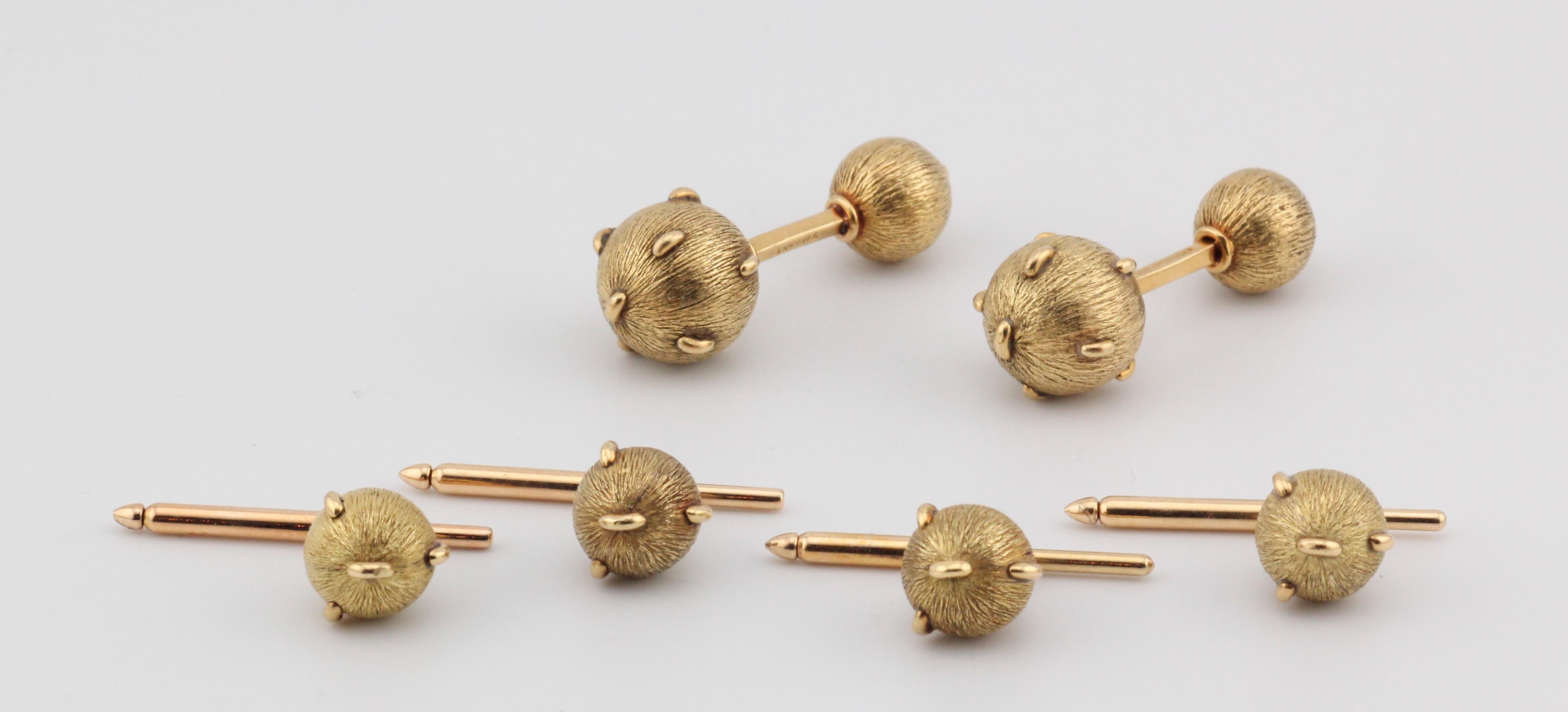 Step into the timeless elegance of the 1980s with this exquisite set of Tiffany & Co. Schlumberger studded and textured 18k gold cufflinks and studs. Designed by the legendary Jean Schlumberger, these pieces are a true testament to his iconic style