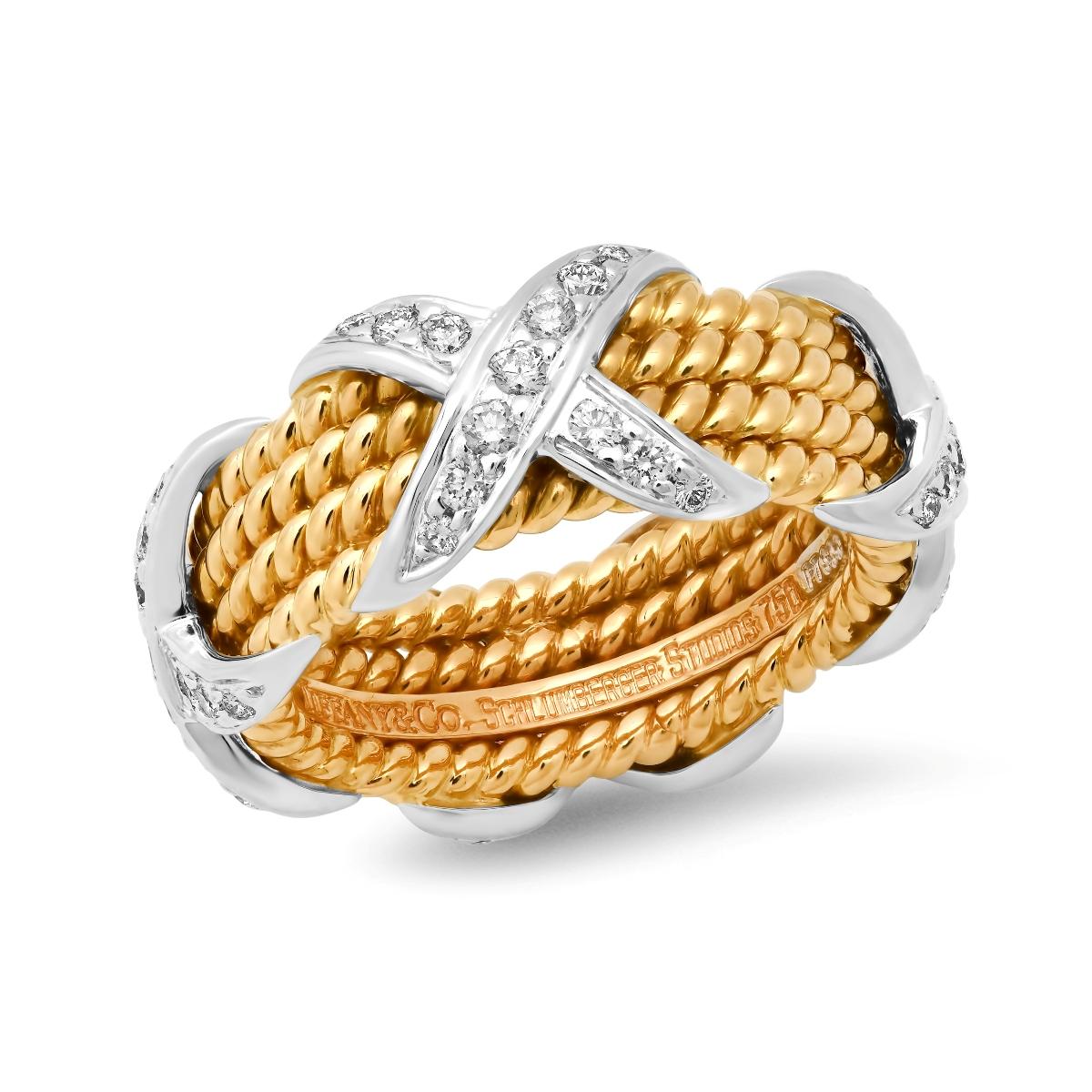 TIFFANY & Co. Schlumberger 18K Gold Platinum Diamond Rope Four-row X Ring 5.5

Metal: 18K gold and platinum
Size: 5.5
Width: 8.6mm at the widest point
Weight: 11.80 grams 
Diamond: round brilliant diamonds, carat total weight .54 
Hallmark: