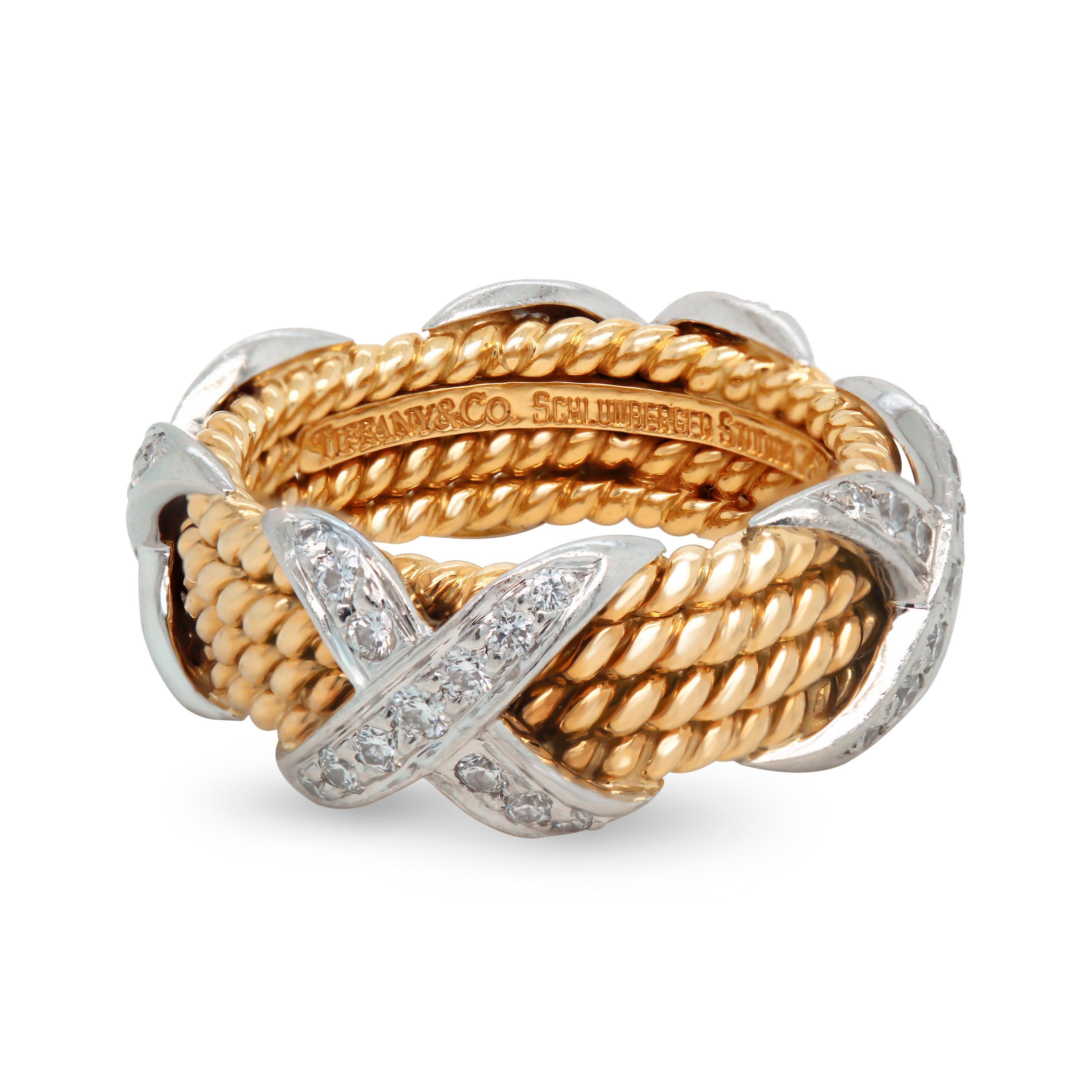 Tiffany & Co. Schlumberger 18K Gold Platinum Diamonds Rope Four-row X Ring

0.54 carat G color, VS clarity diamonds total weight

The four row rope, X ring.

$7,500 MSRP by Tiffany & Co.

8.2mm band width.

Size 6. Ring is in mint condition.
