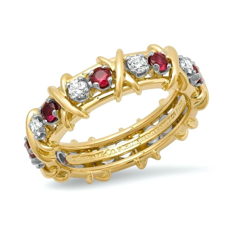 TIFFANY & Co. Schlumberger 18K Gold Eighteen Stone Diamond Ruby X Ring 9.5

Jean Schlumberger’s visionary creations are among the world’s most intricate designs. Brilliant diamonds and rubies alternate with golden X's, creating this dazzling