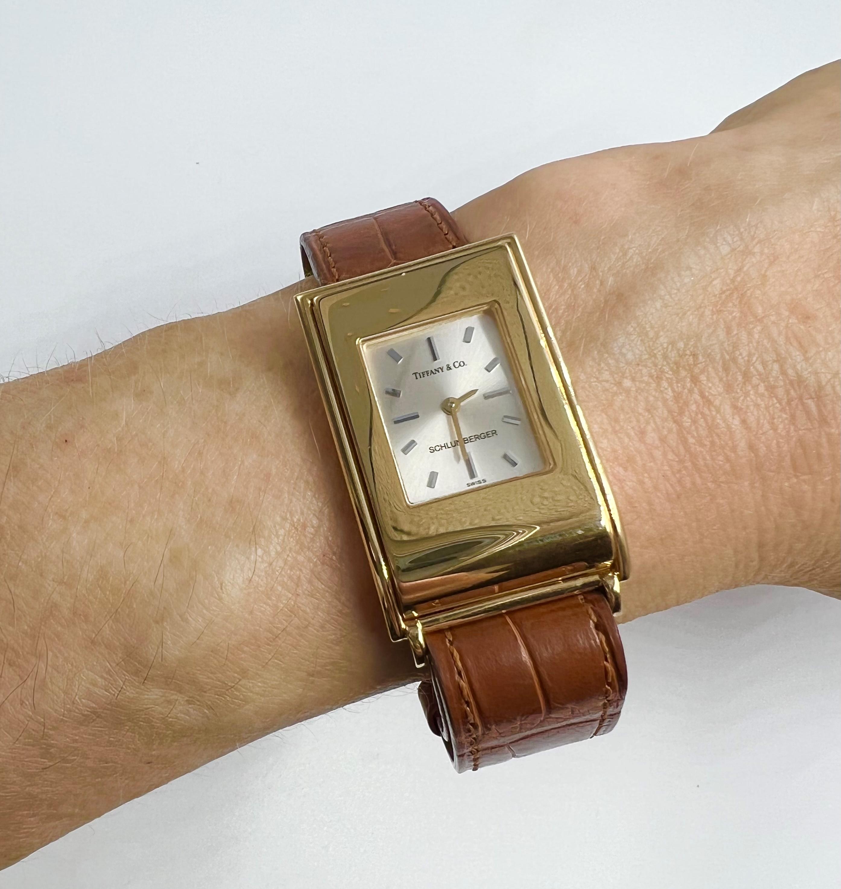 Tiffany & Co. Schlumberger 18k yellow gold lady's wrist watch.  Rectangular case measuring L.35 x W.23.3mm.  Silver tone dial with stick markings and 