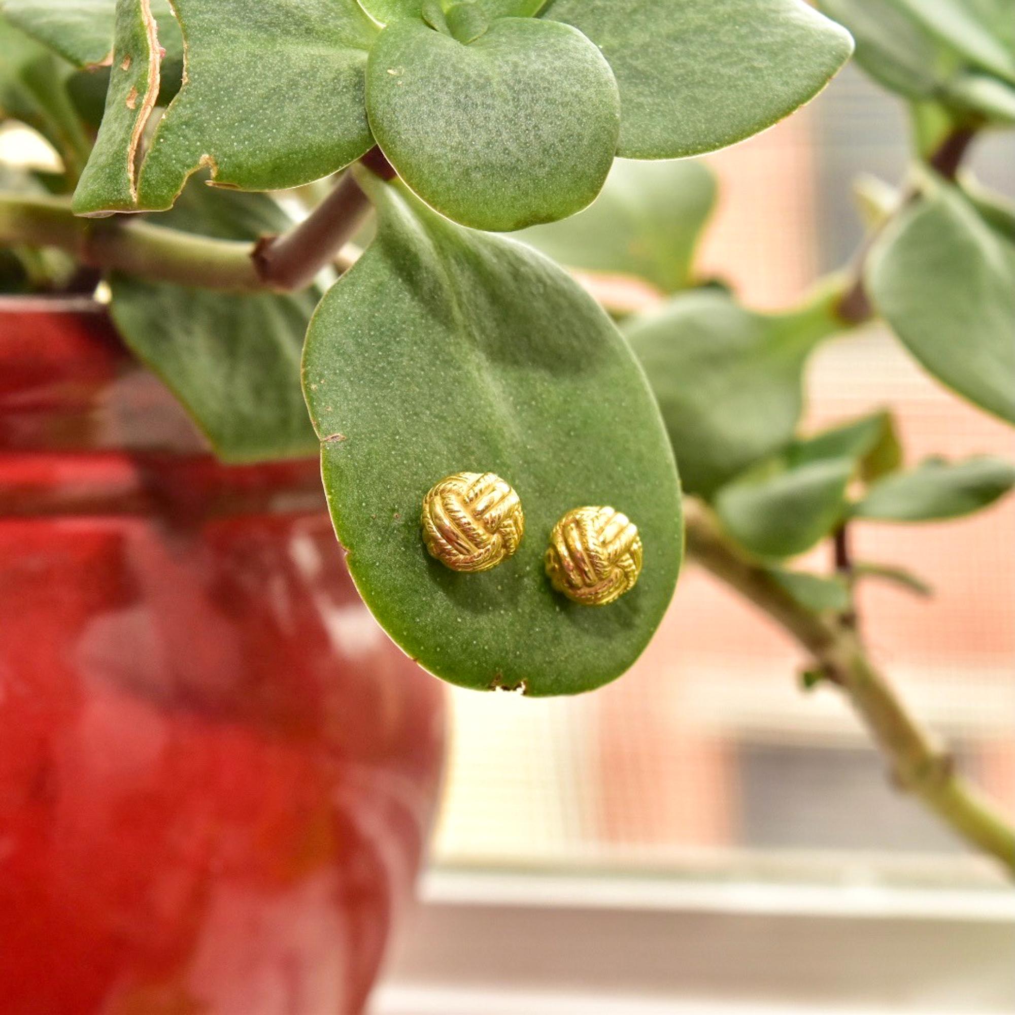 We have an iconic pair of 18K yellow gold 'love knot' earrings designed by Jean Schlumberger for Tiffany & Co. This design is now retired so these earrings are becoming more and more sought after.

Features a knotted yellow gold ball just under 10