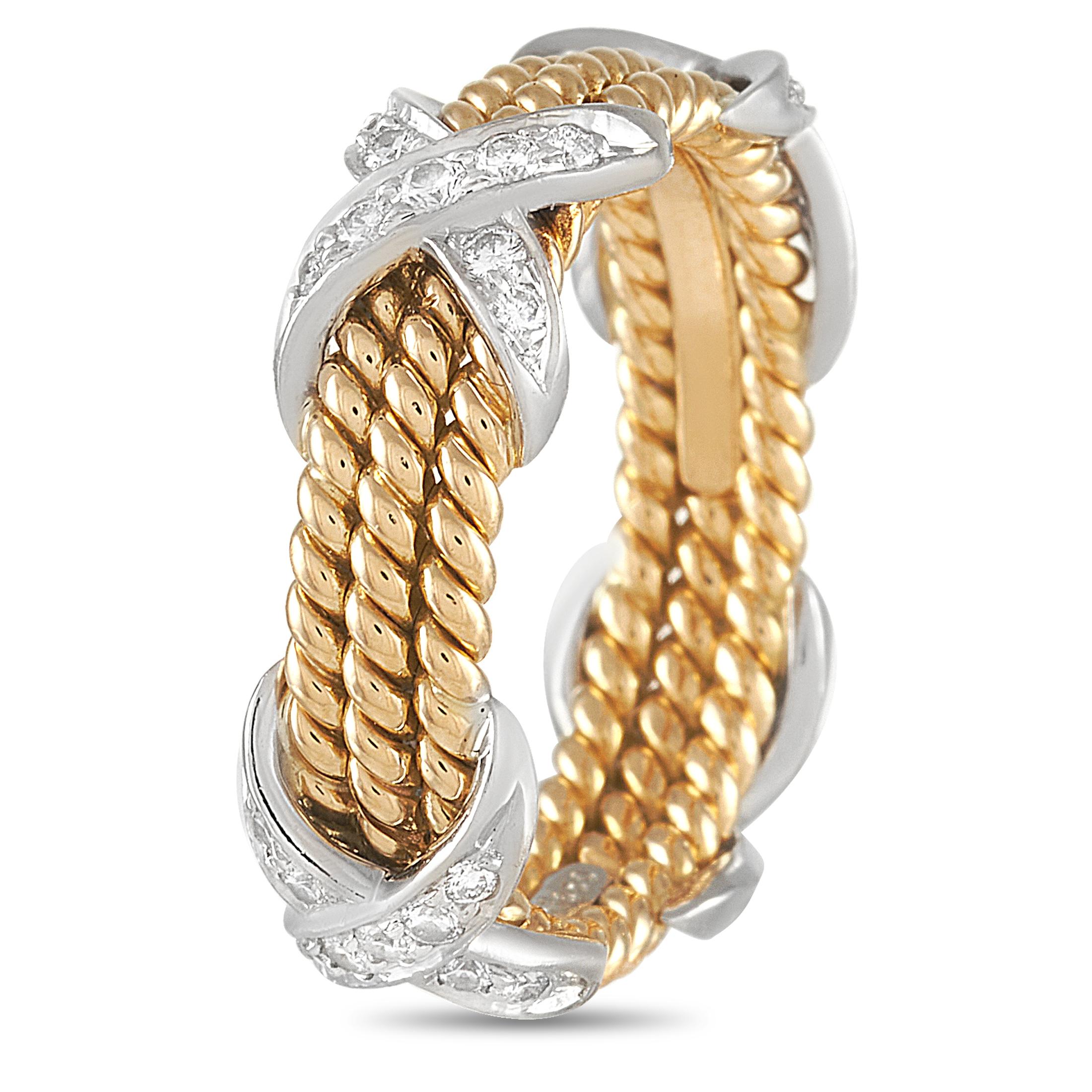 This Tiffany & Co. 18K Yellow and White Gold Diamond Schlumberger Ring is a bold band made with three braided 18K yellow gold bands held together by white gold diamond set x motifs. The ring has a band thickness of 6 mm and a total weight of 7.1