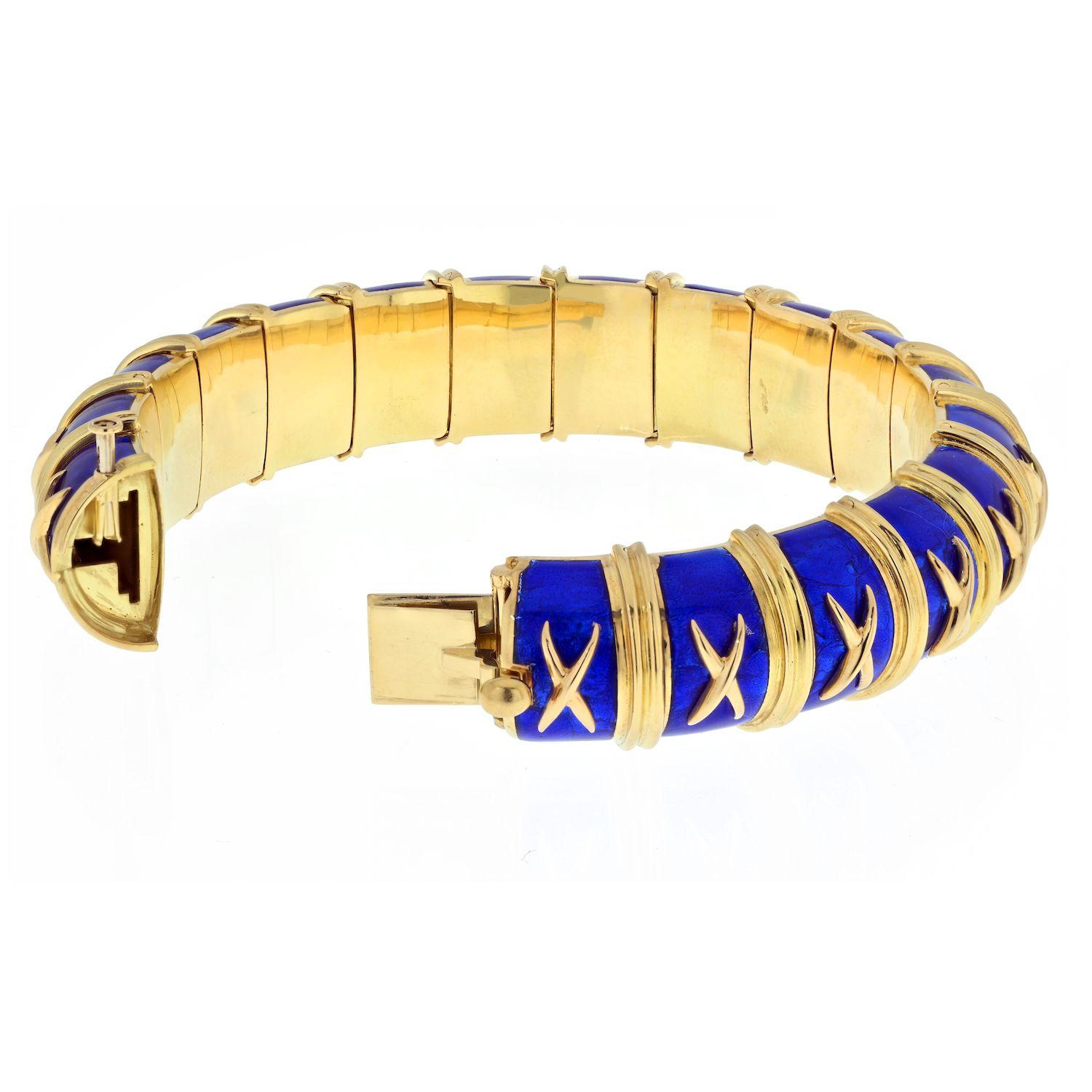 A remarkable estate treasure, the Tiffany & Co. Schlumberger Bangle adorned with exquisite blue enamel. Imprinted with the renowned Tiffany & Co. Schlumberger patern and signature, this bangle exudes sophistication and luxury. Fashioned from 18