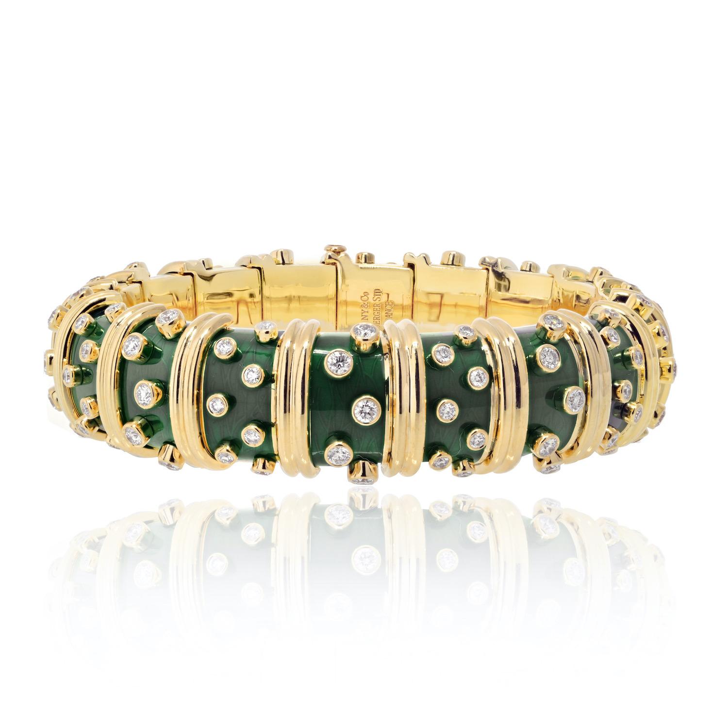 Tiffany & Co. Schlumberger 18K Yellow Gold Deep Bright  Green Enamel And Diamond Bracelet. 

An exquisite creation, a dark green paillonne enamel hinged bangle by Jean Schlumberger that encapsulates the brilliance of design and craftsmanship. This