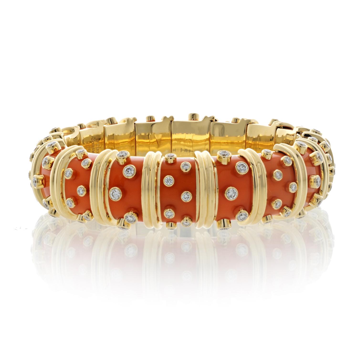 Tiffany & Co. Schlumberger 18K Yellow Gold Orange Enamel And Diamond Bracelet. 

An exquisite creation, orange enamel hinged bangle by Jean Schlumberger that encapsulates the brilliance of design and craftsmanship. This bangle is adorned with