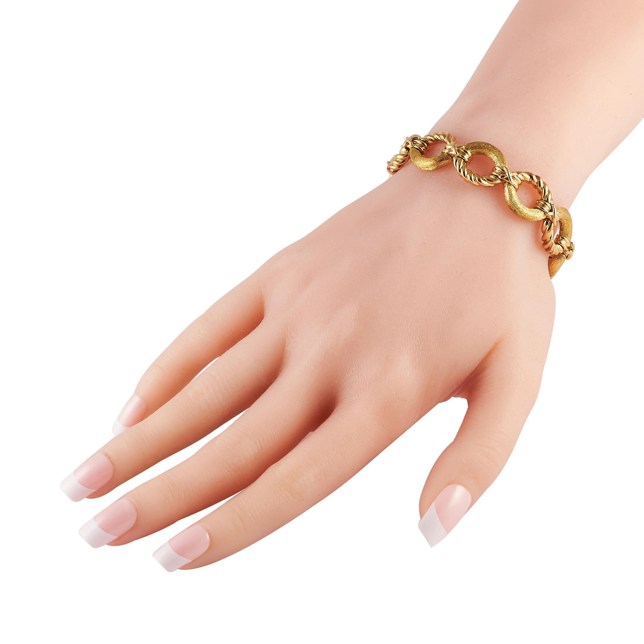 This Tiffany & Co. Schlumburger bracelet is simply exquisite to behold. Crafted from 18K Yellow Gold, differing textures on the dramatic links add dimension to this opulent accessory. This bracelet measures 7.25” long. 
 
 This jewelry piece is