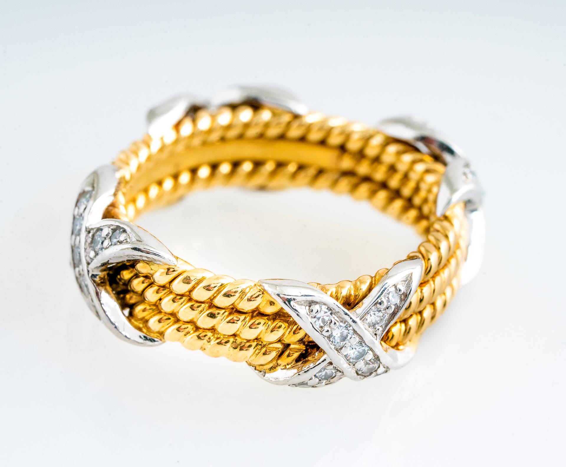 Vintage Tiffany & Co 18K yellow gold and platinum diamond rope x-design ring by Jean Schlumberger.  There are four diamond “X” designs around the ring with 0.28 carat total weight of RBC diamonds G-H color and VS1/VS2 clarity.   Ring is a size 5.
