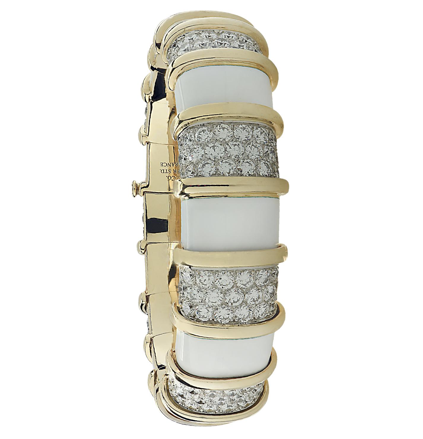 Stunning Tiffany & Co. Schlumberger Bangle Bracelet, crafted in Platinum and 18 karat yellow gold and white enamel, featuring 207 round brilliant cut diamonds weighing approximately 22.5 carats total, E-F color, VVS-VS clarity. Diamond encrusted