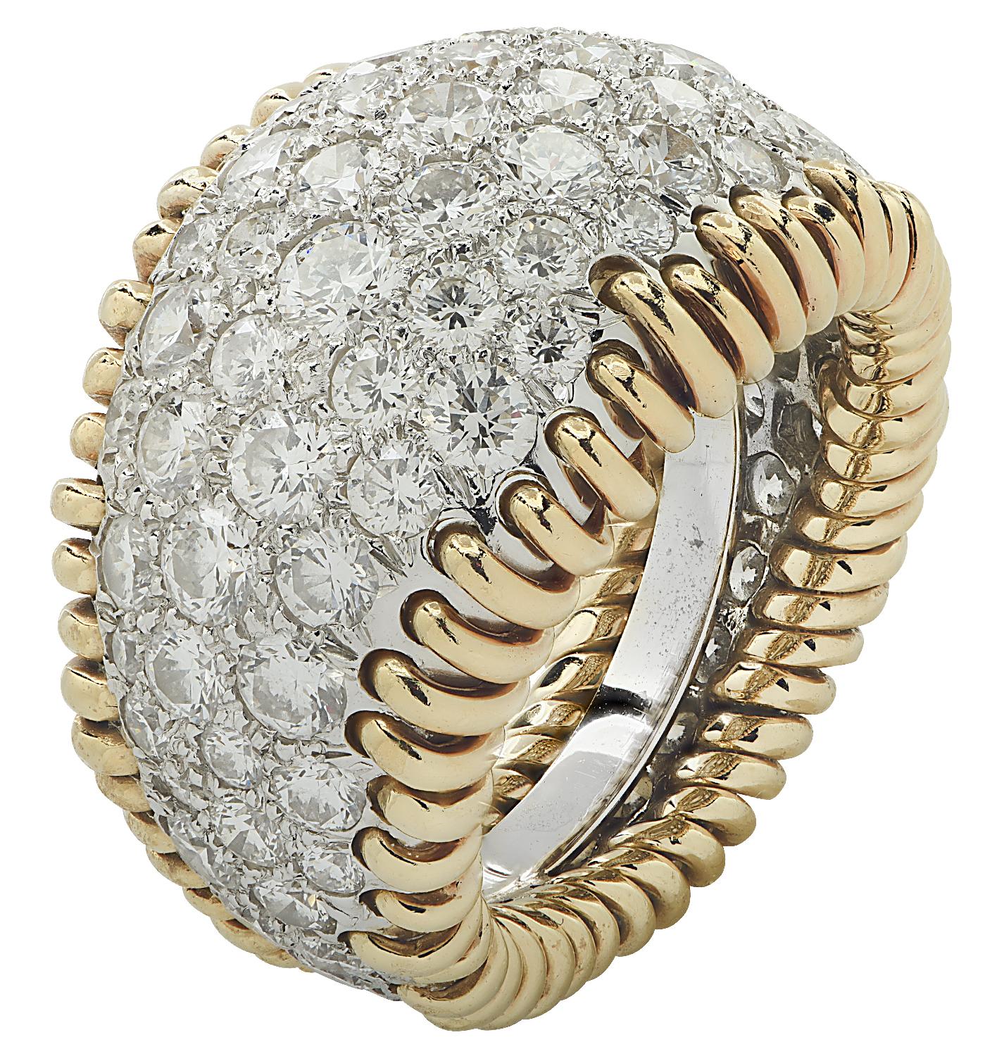 Stunning Tiffany & Co. Diamond Stitches ring by Jean Schlumberger, finely crafted in Platinum and 18 karat yellow gold featuring round brilliant cut diamonds weighing approximately 4.34 carats total, D-E color, VVS-VS clarity. The bombe ring is
