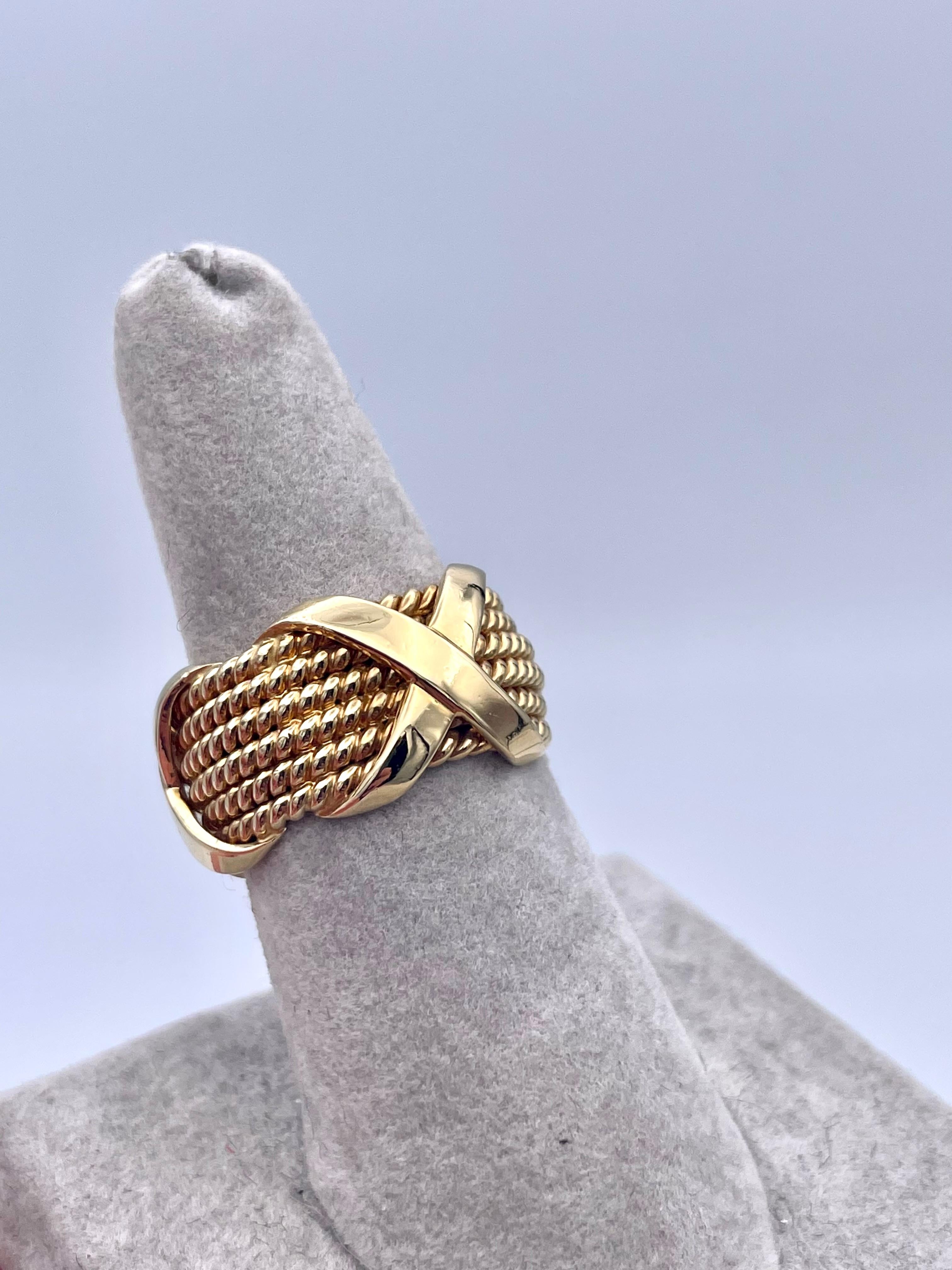 Bold wide 6-row X band.  Made by SCHLUMBERGER for TIFFANY & CO.  Heavy gauge 18K yellow gold.  Very crisp condition.Size 6 1/4.  Seldom seen in this wide size.

Alice Kwartler has sold the finest antique gold and diamond jewelry and silver for over