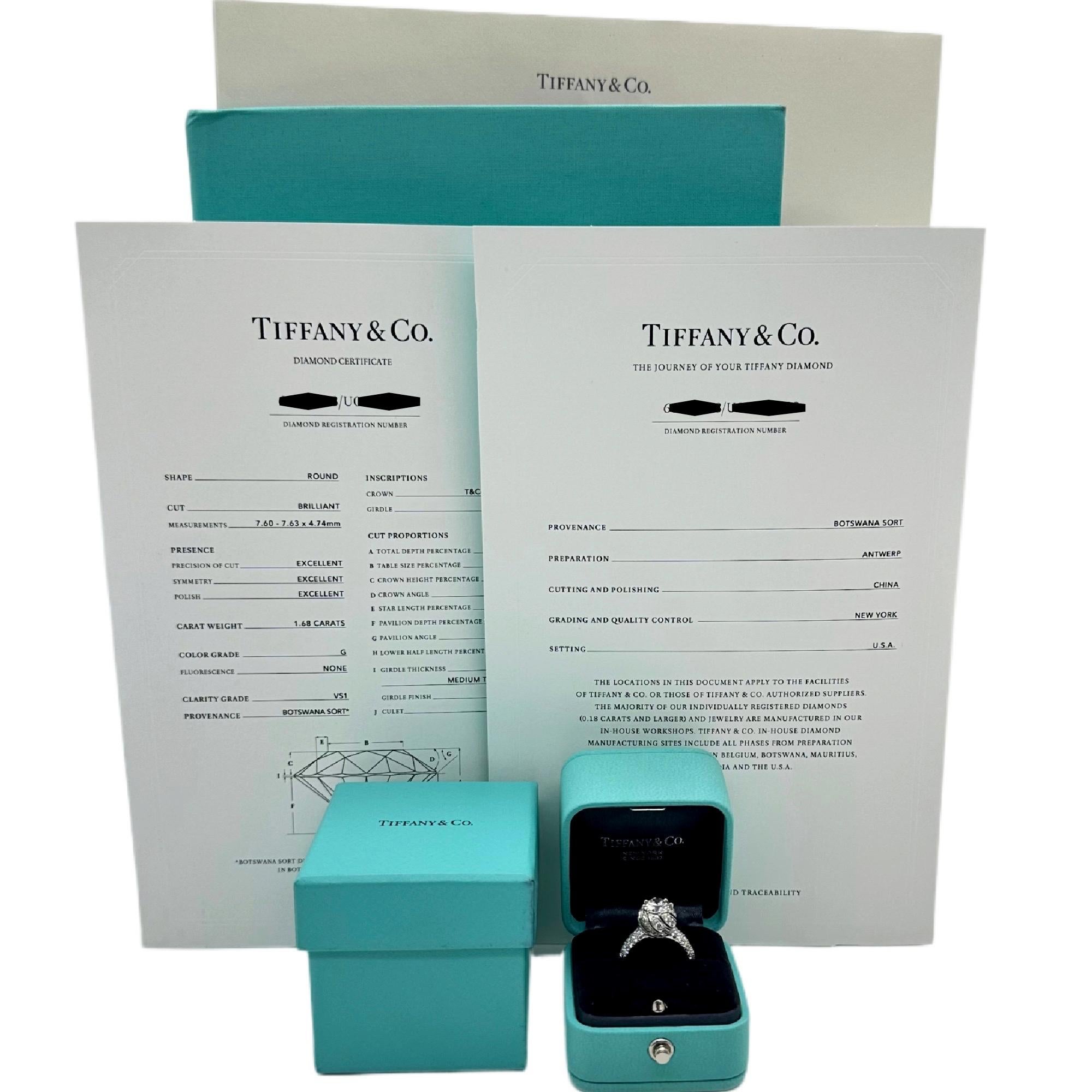 Tiffany & Co. BUDS by Jean Schlumberger Diamond Engagement Ring
Style:  Diamond Accents
Ref. number:  171/23/68887488
Metal:  Pt950 Platinum
Size:  6
TCW:  2.90 tcw
Main Diamond:  Round Brilliant Diamonds 1.68 cts
Color & Clarity:  G, VS1
Accent