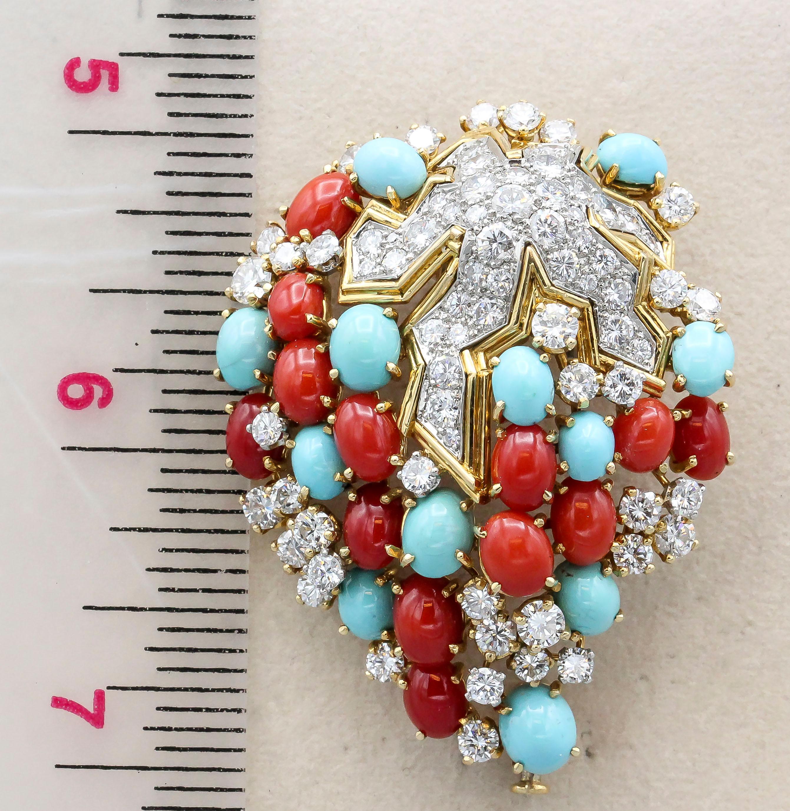 Very fine and rare brooch by Tiffany & Co. Schlumberger.  Made in 18k yellow gold and platinum, with an array of cabochon turquoises, corals, and diamonds set throughout. Featuring approx. 6 carats of high grade white diamonds.  A more abstract