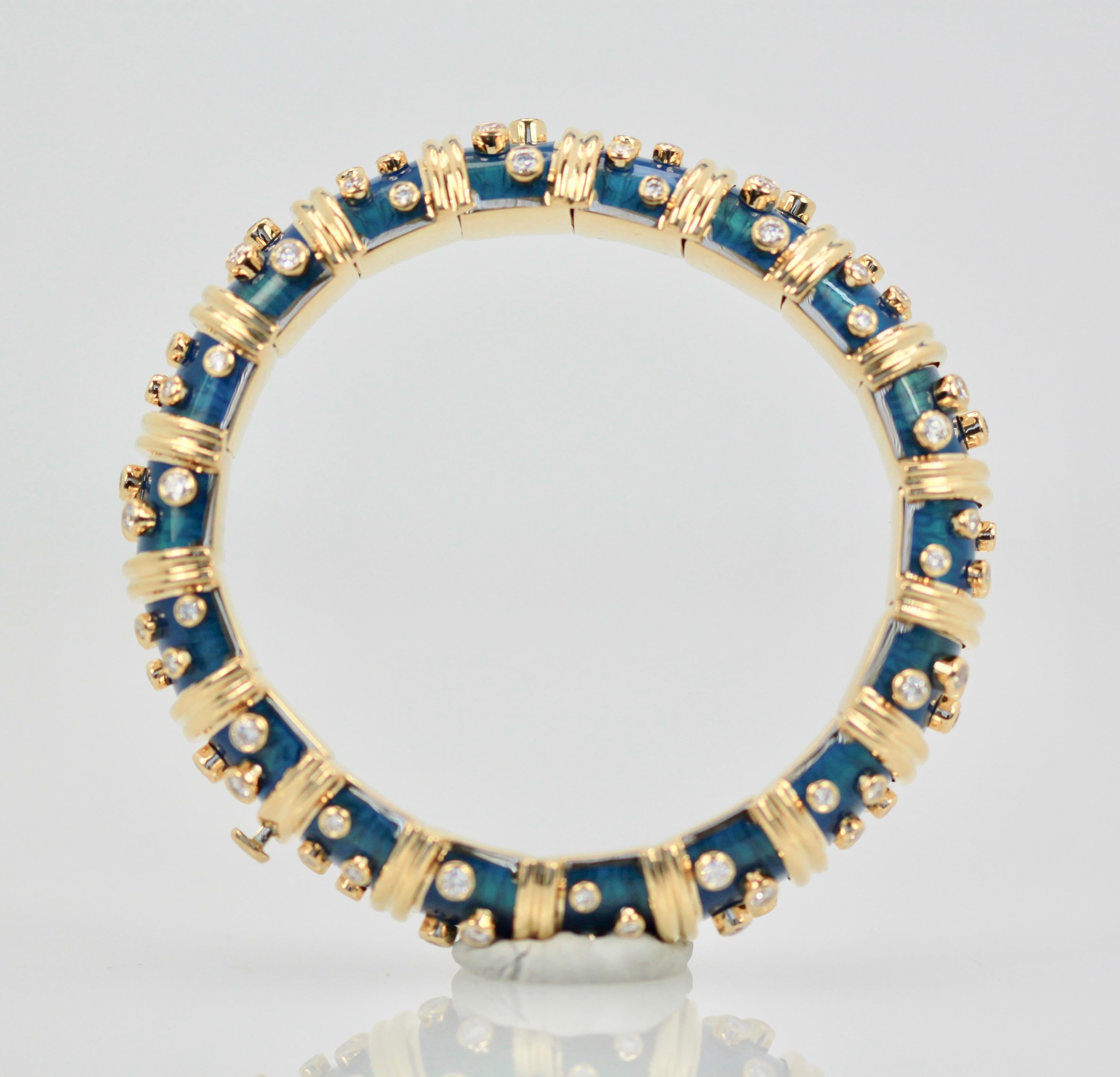 This Tiffany & Company Schlumberger Diamond Bracelet is in near mint condition.  The bracelet has barely been worn as all the segments are very tight.  This is the Blue Enamel bracelet with 108 Diamonds approximately 8 carats and fits a size 6 to 7
