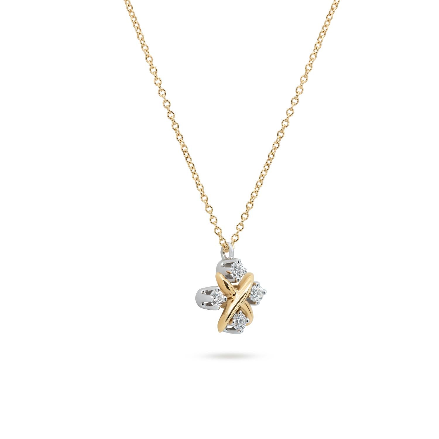 Indulge in the epitome of luxury with the Tiffany & Co. Schlumberger Diamond Pendant necklace. Meticulously crafted in platinum and 18k yellow gold, this exquisite piece exudes opulence. The 